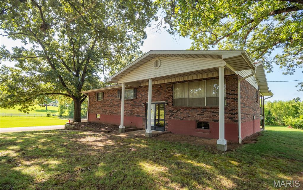 Welcome to 874 County Road 442, a charming property filled with character and incredible potential. Nestled in an established area surrounded by beautiful homes, this inviting residence offers the perfect opportunity to create your dream home or invest in a property with endless possibilities. Enjoy peaceful water views that provide a relaxing backdrop for everyday living while still being only minutes from shopping, dining, schools, and all the conveniences of town. Whether you're looking for a full-time residence or a weekend retreat, the location offers the ideal balance of privacy and accessibility. One of the standout features is the impressive oversized workshop, providing abundant space for hobbies, projects, or extra storage. There's plenty of room for boats, classic cars, ATVs, recreational equipment, tools, and all your favorite toys. With ample parking and flexible space, this property is well-suited for outdoor enthusiasts, collectors, or anyone needing additional storage. The surrounding neighborhood enhances the appeal, with attractive homes and a welcoming atmosphere that adds long-term value. If you've been searching for a property where you can personalize, expand, or simply enjoy the peaceful setting, 874 County Road 442 is a rare opportunity you won't want to miss. Come explore the possibilities and imagine the lifestyle waiting for you.