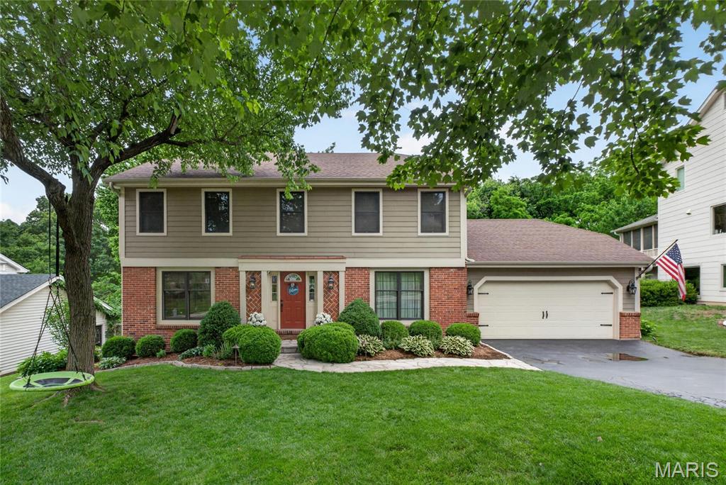 Picturesque Turnkey Two Story in Des Peres with sought after Kirkwood schools!  Classic Curb Appeal on this beautifully landscaped 4 bed, 3.5 bath home with stone paver walk way and brick front porch. Front door with glass sidelights and stylish fixtures. Real hardwood floors throughout much of main floor.  Entry foyer is flanked on one side by living room that leads into open, expanded kitchen.  Kitchen features large center island, granite tops, and stainless steel appliances. Island flows into large dining room with tons of windows providing natural light.  Incredible family gathering area to sit and enjoy meals!  Expansive Great Room with fireplace steps down from kitchen.  Main floor laundry and lockers as well.  Primary bedroom upstairs with spacious walk in closet.  Updated primary bath with glass shower door and floor to ceiling tile.  Oversized vanity with granite top.  Three other beds for the family upstairs with renovated hall bath featuring double vanity, tile floors, and tile walled tub/shower.  Finished Lower level with built in bookshelves in Rec Room.  Great work from home space or let the kids play.  Add’l finished/sleeping room plus workout area and full bath.  Step out back to brick paver patio overlooking beautifully manicured rear yard and landscaped beds. Peaceful, serene setting to relax and BBQ or watch the kids play in the built in fort or swing set. All of this plus craftsmen style garage door with coach lights.  Convenient Location off Ballas.  Easy access to Manchester or Daughtery Ferry near St Gerard school. Charming Two Story home with over 3,200+ total sq feet of living space in Desirable Des Peres is perfect for the growing Family!