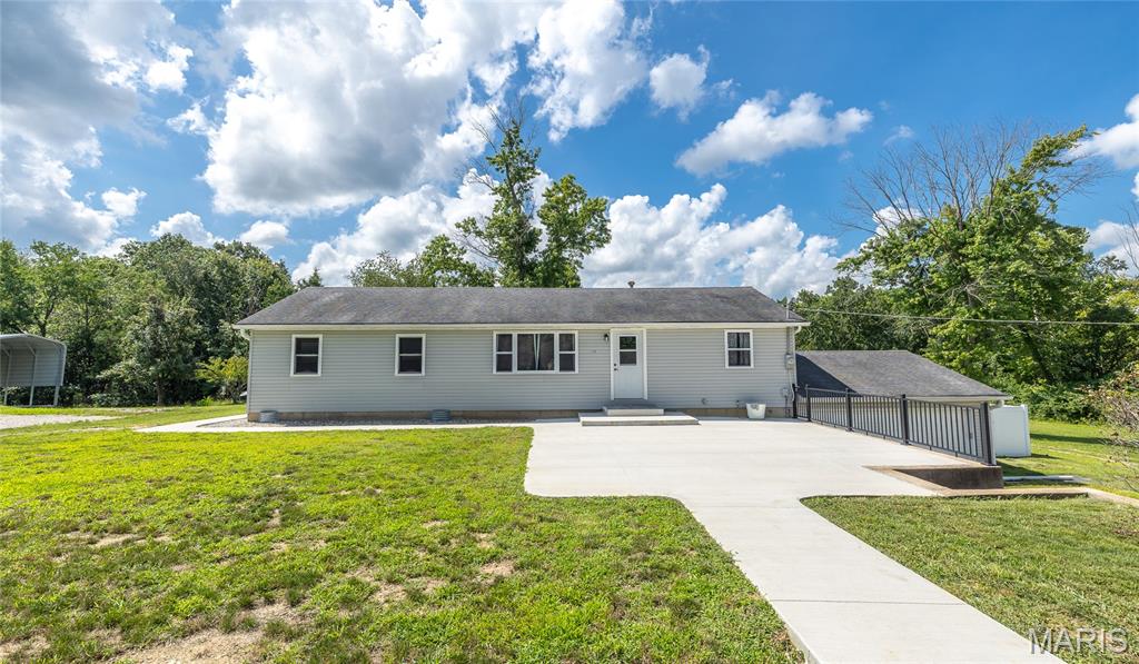 Move in ready on 2.29 acres with an incredible **57' x 30' shop** featuring three overhead garage doors and a 9,000 pound vehicle lift. Perfect for mechanics, hobbyists, or anyone needing serious workspace! This beautifully updated home offers **3 bedrooms, 1 bath, plus a finished basement room that could serve as a 4th bedroom, office, or bonus room. Enjoy a completely renovated main level with a new kitchen, updated flooring, fresh carpet, and modern finishes throughout. An attached 2 car garage adds even more convenience. The home is served by a shared well with the adjoining property, which is also available for purchase, creating a rare opportunity for a private family compound, multigenerational living, or additional investment potential.