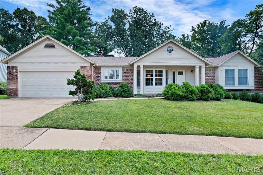 Beautiful 3-bedroom/2-bath ranch home with a walk-out basement in the Green Trails subdivision! As you step inside, you'll be welcomed by a bright, open floor plan designed for comfortable everyday living and entertaining. The vaulted ceiling and large picture windows fill the spacious living room with natural light while offering beautiful views of the backyard. The living room also features a cozy wood-burning fireplace and a convenient wet bar. The kitchen offers bar seating and flows seamlessly into both the living room and dining area, creating the perfect gathering space for family and friends. The main level includes a private office, a convenient main floor laundry room, two generously sized bedrooms and a full hall bathroom. The spacious primary suite features a walk-in closet and a private bathroom. The unfinished walk-out lower level provides endless possibilities and is ready for your personal finishing touches, whether you envision additional living space, a recreation room, home gym or workshop. Step outside to relax on the back deck overlooking the peaceful, tree-lined backyard. Plus an attached two-car garage. Conveniently located with quick access to highways, shopping and restaurants.  Don't miss your chance to make it yours!