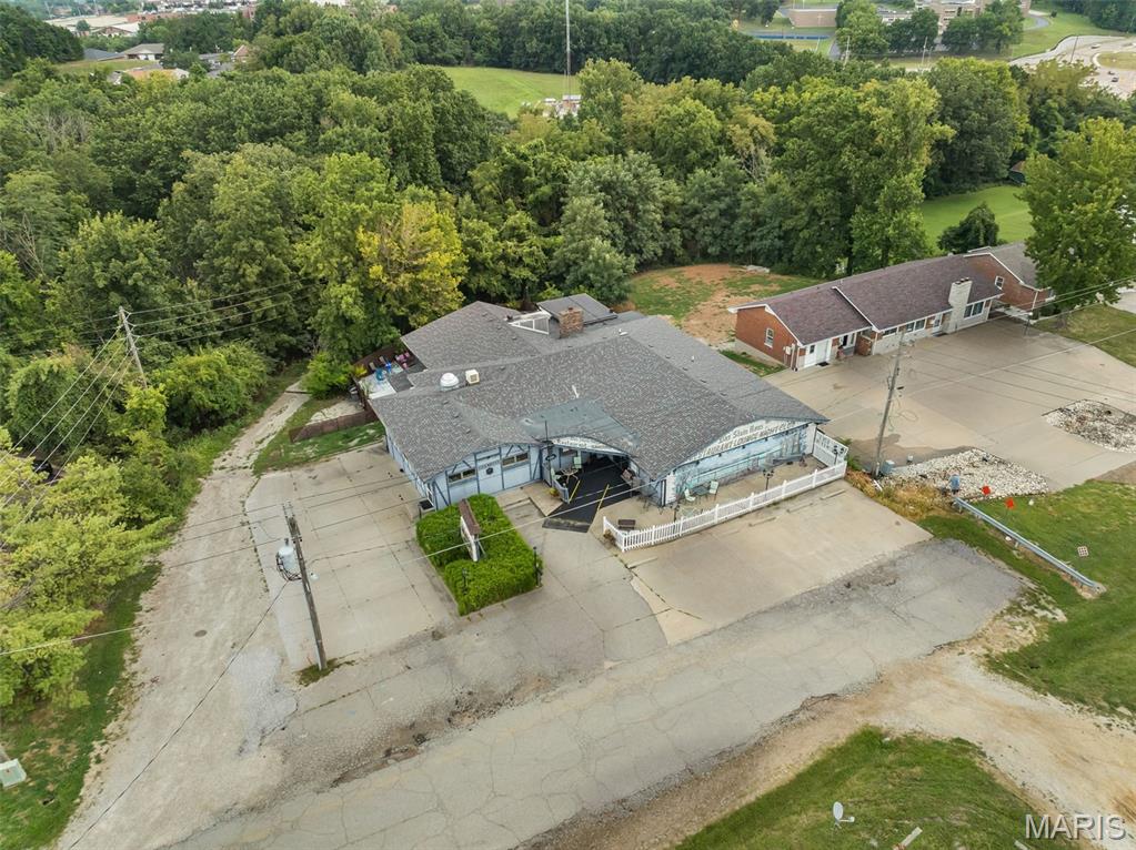Step into a rare opportunity to own one of Jefferson City's most recognized neighborhood establishments. For 45 years, Das Stein Haus has been a destination for great food, memorable gatherings, and lasting traditions. Rich in history and character, this iconic restaurant offers the perfect blend of a proven business and an exciting opportunity for its next owner. Situated on approximately 0.48 acres, this impressive 6,500± square foot property is being offered as a true turnkey operation. The sale includes the real estate, all restaurant equipment, furnishings, decor, fixtures, the established business name, recipes, and everything needed to continue serving customers from day one. Designed to accommodate everything from casual dining to private events, the restaurant features approximately 180 indoor seats, including about 50-seat bar area with 19 bar stools and five separate dining rooms offering over 100 additional seats for private parties and special occasions. Outside, guests can enjoy a spacious patio complete with additional seating, seperate bar and a stage for live entertainment, creating an inviting atmosphere for seasonal events, private parties and community gatherings. The property also includes approximately 15 private parking spaces, with additional on-street parking and convenient access to a nearby state parking lot. Living quarters with 3-non conforming bedrooms, 1.5-bath on the lower level provides excellent flexibility as an owner's residence, employee housing, or additional income-producing space. Whether you choose to preserve the legacy of Das Stein Haus or build upon its outstanding reputation, opportunities like this are exceptionally rare. Acquire an established, fully operational restaurant with 45 years of history, a loyal customer base, recognized branding, and the ability to begin operating immediately--all in one of Jefferson City's well-known dining destinations.