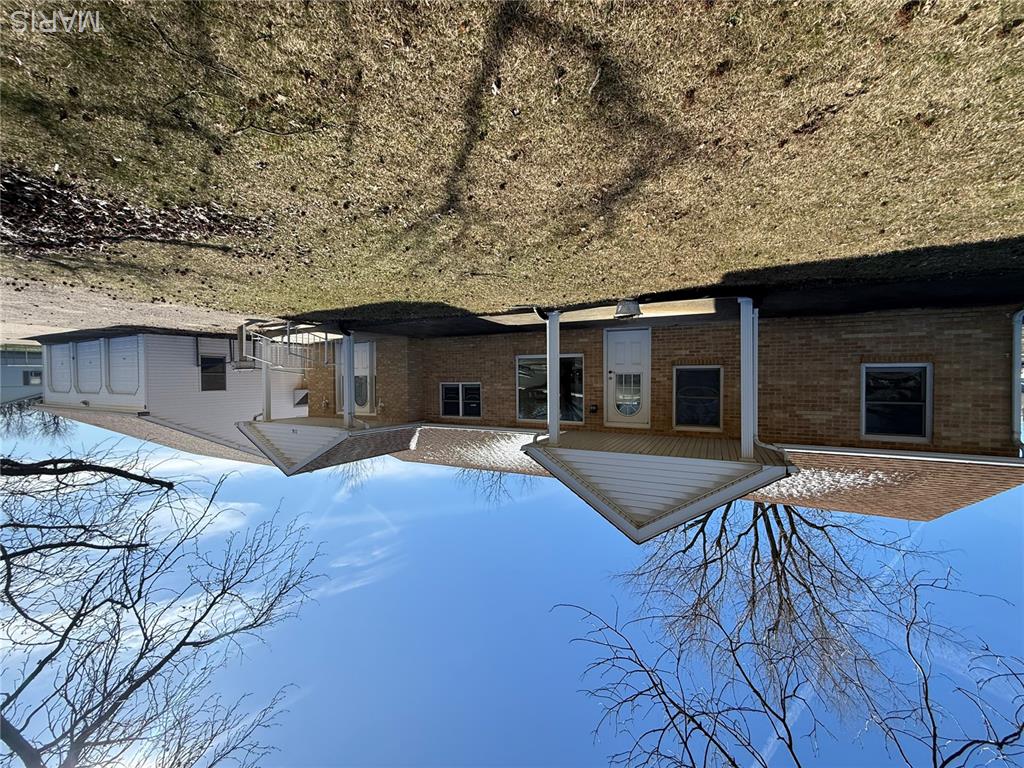 2 bed, 2 full bath home with tons of potential! Features a spacious primary suite with private bath and a bright sunporch overlooking the backyard. Large fenced yard and a 3-car garage with heated workshop, attic storage, and bath rough-in. With a little TLC, this one could really shine!