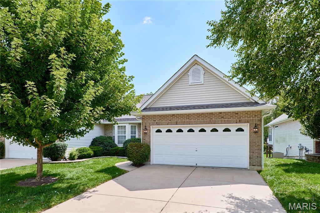 Well kept 3Bed/3Bath villa in the heart of North O'Fallon! This property features a brick front, 2 car garage, 1 year old roof, and backs to common ground. Interior features include ceramic tile, stainless steel appliances, gas fireplace, bar top counter, NEW carpet on the main floor, FRESH paint throughout the home, vaulted ceilings, and MAIN floor laundry. Primary bedroom features couffered ceilings, 2nd door to deck, double sink, walk in closet, and jacuzzi/separate shower! FINISHED lower level (lookout) has a 2nd kitchen (fridge, dishwasher, sink), bedroom, full bath, & gas fireplace. (Both refrigerators, washer, & dryer can all stay).
