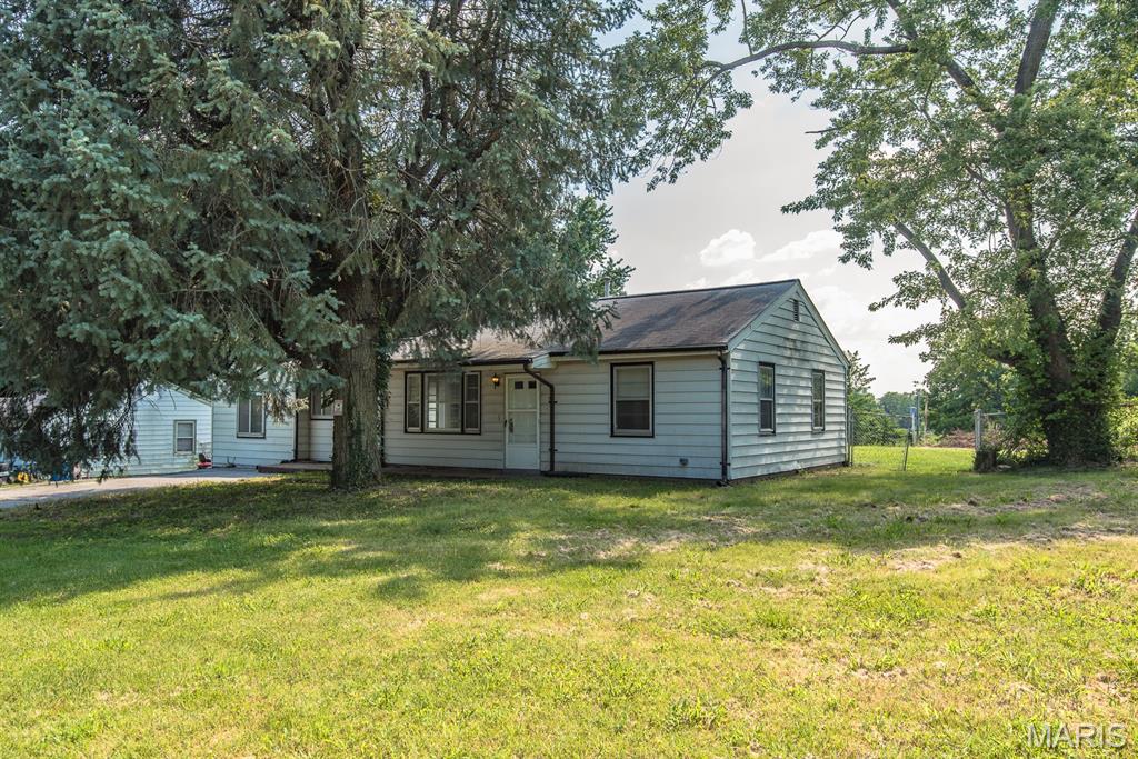 Welcome to this beautiful home with over 0.6+/- acres located in the established North St. Louis County area, 10253 Imperial Dr offers a solid opportunity for homeowners or investors seeking value and potential! This property features a functional layout with a comfortable living space - spacious bedrooms, a dedicated living room area, main floor laundry room / mud area and a kitchen with room for updates or personalization. Bedrooms are well-sized, providing flexibility for family living, guests, or a home office setup. Natural light flows throughout the home, creating a bright and welcoming atmosphere. The property sits on a huge lot with with the backyard being partially fenced - this outdoor space suitable for relaxation, gardening, playset, firepit area, sheds/outbuildings+++ Endless options! Conveniently located near schools, shopping, dining, public transportation, and major highways, this home provides easy access to everyday essentials and the greater St. Louis area. With its strong location within the Riverview Gardens School District, this property presents an excellent opportunity for renovation, rental income, or long-term residence. A great option for buyers looking to add value in a growing community. Comes with a passed occupancy AND a Home Warranty! Hurry, this won't last long