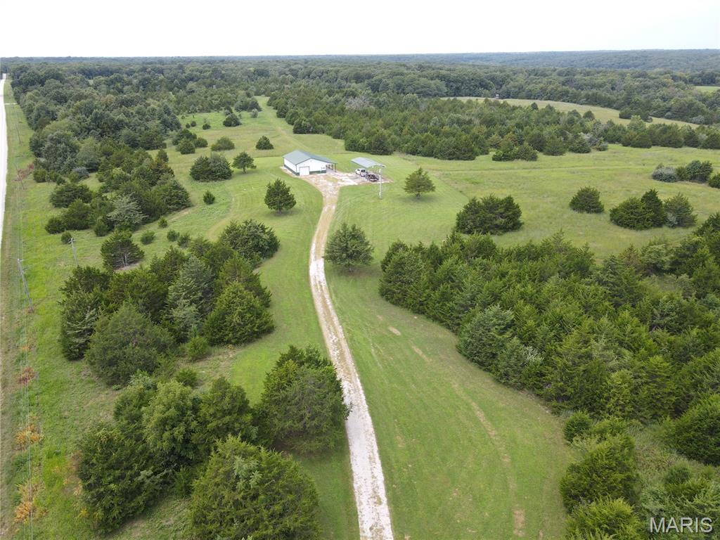 Ralls County, MO 30 acres at Mark Twain Lake.  This gated 30 acre tract is perfectly suited for hunting and outdoor recreation offering excellent deer and turkey hunting with an abundance of trophy bucks and toms.  This diverse property features open native grass fields, mature timber, cedar trees, and two ponds offering excellent cover and forage for deer and turkey.  Numerous signs of wildlife were visible while walking the property, and trail camera photos confirm this farm hosts an abundant deer population. With its ideal mix of cover, food, water, and seclusion, this property provides everything needed to be a premier hunting destination in Northeast Missouri. Improvements include a 30' x 50' Morton Building with a small finished area containing a kitchenette, bathroom, and living room leaving plenty of room for your lake toys and equipment.  Also included are a concrete RV pad with an awning, and all utilities (water, electricity, and sewer).   This property is located less than 15 minutes from Monroe City, Mark Twain Lake, Jellystone Park, Water Zone, Spalding Recreation Area and Beach, Clarence Cannon Dam, Blackjack Marina, restaurants, and more.  It's an ideal property and you won't be disappointed.  Missouri hunting season will be here SOON.  See it, Love it, Own it TODAY.
