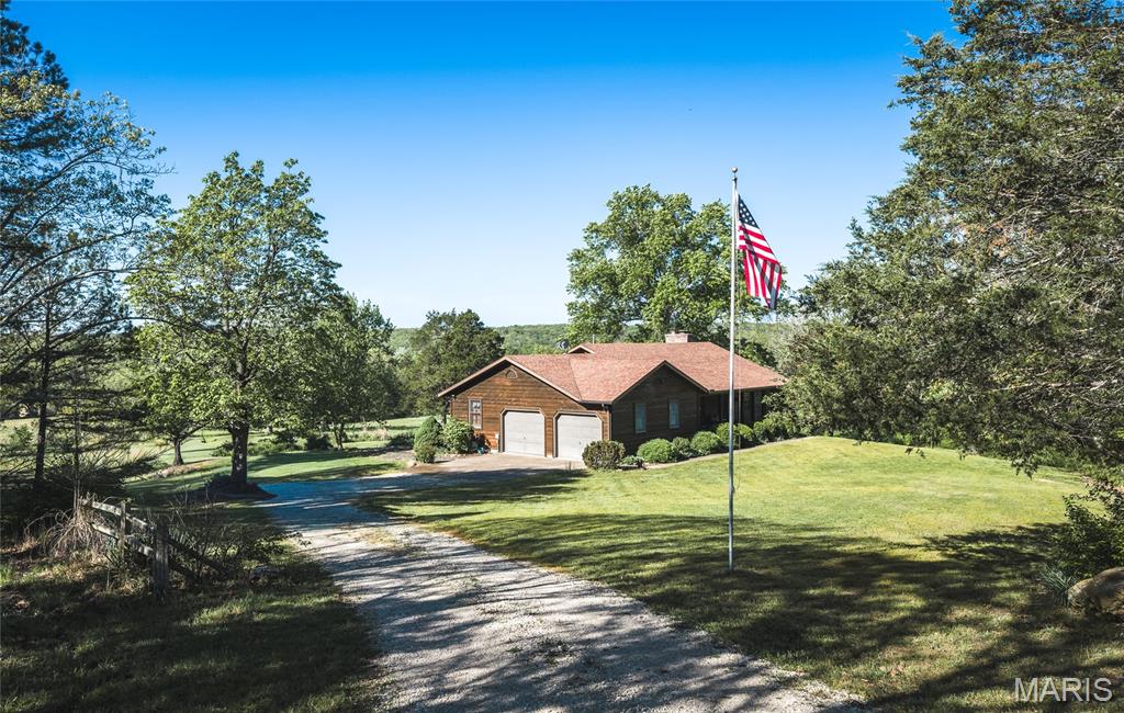 Located along paved Highway CC in the heart of Gasconade County, this exceptional 140+/- acre farm delivers the complete package for buyers seeking a full-time residence, weekend retreat, recreational escape, or turn-key hunting property in the Missouri Ozarks. Combining live water, diverse habitat, productive pasture, mature timber, historic character, and a beautifully maintained home, this property showcases the very best of what the mid-Missouri Ozarks have to offer.
The first thing you notice is the manicured rolling pastures and scenic topography that create both functionality and beauty. The homesite transitions seamlessly into rich creek bottoms and mature hardwood ridges, offering a landscape that is as productive as it is picturesque. The timber component includes mature oak, walnut, and pine, providing excellent wildlife habitat, seasonal beauty, and long-term value.
Water is one of the defining features of this farm. A spring-fed 0.9 acre pond offers year-round beauty, fishing opportunities, and a dependable water source for wildlife. In addition, the property boasts frontage along Dry Creek, a clear, year-round flowing stream that creates outstanding travel corridors for deer, turkey, and small game. Multiple live water sources of this caliber are rarely found on a single tract, making this property exceptionally desirable for both recreation and land investment.
Wildlife enthusiasts and hunters will immediately recognize the habitat diversity that makes this farm special. The combination of hardwood ridges, creek bottom cover, open pasture, edge transitions, and reliable water creates ideal conditions for thriving populations of whitetail deer, wild turkey, and small game. Whether your goal is managing wildlife habitat, enjoying family hunting traditions, or simply watching game from the back deck, this property is set up to deliver year after year.
At the heart of the farm sits a well-appointed and meticulously maintained ranch-style home offering approximately 2,866 square feet of total living space. This spacious 4-bedroom, 2.5-bath walk-out home was designed to take full advantage of the surrounding landscape while offering modern comfort and convenience. Features include a two-car garage, established landscaping, an elevated deck perfect for morning coffee or evening sunsets, and a walk-out patio ideal for entertaining family and friends. Large windows and thoughtful positioning provide beautiful views of the surrounding Ozark countryside.
Adding to the property's character and history are several historic improvements, including a hand-laid stone spring outlet and an original homestead structure that reflects the rich agricultural heritage of this region. These unique features add authenticity, storytelling, and charm that cannot be replicated.
Location is another major advantage of this offering. The property is just 8 miles from Owensville, 11 miles from Belle, and 15 miles from Rosebud allowing convenient access to shopping, dining, and entertainment while maintaining the privacy and serenity of country living.
Outdoor recreation opportunities extend far beyond the property lines. Positioned between the Gasconade River and Bourbeuse River, owners will enjoy easy access to floating, boating, fishing, and water recreation. Nearby public lands including Canaan Conservation Area and Mint Spring Conservation Area provide additional hunting opportunities. For those who appreciate food, wine, and local culture, the property sits adjacent to Missouri’s renowned Rhineland region, with wineries nearby and historic Hermann only a short drive away.
Whether you are searching for a premier Missouri hunting farm, an equestrian-ready country estate, a multi-generational family retreat, or a highly diversified Ozark land investment, this remarkable Gasconade County property offers a rare opportunity to own a truly complete farm with live water, history, wildlife, and modern comfort all in one exceptional package.