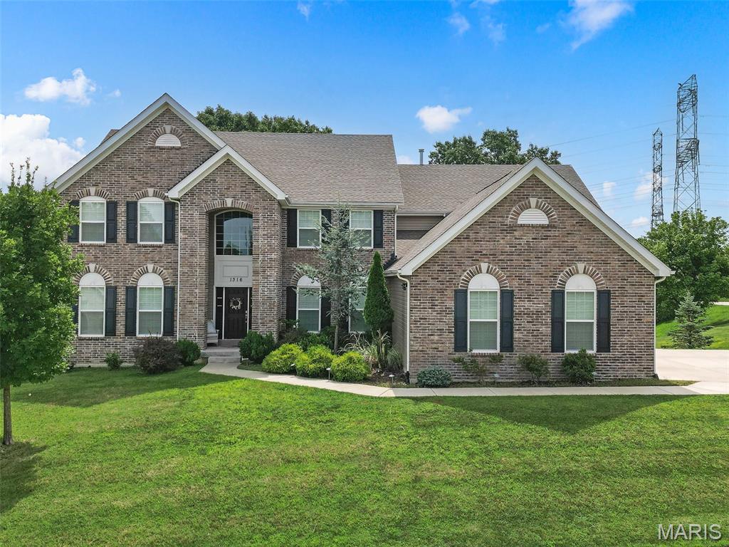 ~ INSTANT EQUITY!!!!! ~Luxury, Space & Serenity on 1.26 Acres

Welcome to this impressive 1.5-story executive home offering more than 4,000 square feet of beautifully designed living space, nestled on a picturesque 1.26-acre corner lot surrounded by mature trees, rolling hills, and peaceful wooded common ground.  This home is priced to sell and MOVE IN READY!!!

Step inside to an inviting open floor plan highlighted by soaring cathedral ceilings, dramatic floor-to-ceiling windows, and a fireplace that creates an elegant focal point in the great room. The spacious kitchen is designed for both everyday living and entertaining, featuring a large center island, abundant cabinetry, and a stylish coffee and butler's pantry bar addition.

The main-floor primary suite provides a private retreat, while the convenience of main-floor laundry adds to the home's thoughtful design. Upstairs, you'll find generously sized bedrooms along with a massive bonus room offering endless possibilities for a media room, home office, playroom, or additional gathering space.

Outdoor living is equally impressive. Relax or entertain on the composite deck with waterproof under-decking, or enjoy the extended patio overlooking the wooded backdrop. An oversized driveway provides plenty of room for multiple vehicles and easy access in and out, while the fully insulated three-car garage offers exceptional space for vehicles, storage, and hobbies.

Additional highlights include dual HVAC systems and a 9-foot walkout lower level ready to be finished to your vision, providing incredible potential for even more living and entertaining space.  Add extra bedrooms, bathroom, recreation, gym, hobby area etc.  The opportunities are endless and a great way to build financial gains.

Located in a gorgeous neighborhood known for its acre-plus homesites, mature trees, and rolling landscape, this exceptional property offers a rare combination of privacy, space, and convenience—all just a short drive from Babler State Park, shopping, dining, and everyday amenities.

An exceptional home, a beautiful setting, and room to live, entertain, and grow.
