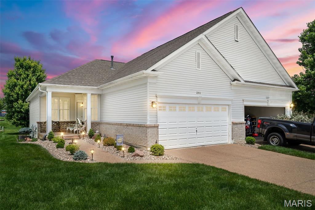 Welcome to the sought-after 55+ gated community of Heritage of Hawk Ridge in Lake St. Louis! This beautifully updated villa offers low-maintenance living with a welcoming covered front porch, new roof, 9-foot ceilings, fresh paint, new LVP flooring, upgraded trim, and updated doors throughout.

The open floor plan features 2 bedrooms, 2 full bathrooms, and a spacious great room that flows into the dining area and updated kitchen complete with white cabinetry, upgraded countertops, and an eat-in breakfast nook. Enjoy outdoor living with a covered deck and patio, plus the convenience of a 2-car attached garage. The unfinished lower level provides endless potential for additional living space, hobbies, or storage.

Beyond your doorstep, enjoy the incredible lifestyle Heritage of Hawk Ridge has to offer, including golf, pickleball, tennis, fitness center, swimming pool, clubhouse with dining, and a wide variety of social activities such as yoga, gardening, crafts, dance, book club, bridge, and so much more!

This is more than a home—it’s a vibrant community designed for active, carefree living!