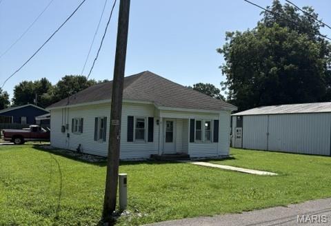 A home with a solar panel system sound perfect for you!  Well here it is.  The home includes 3 bedrooms and 1 bath with an eat in kitchen with a range/oven, overhead microwave , dishwasher and disposal.    There is a 30'x40' concrete floor shop with 2 overhead doors and a walk through door.  The shop has both 110 and 220 electric and a half bath and hot water.  The shop also contains a wood burning stove and it is fully insulated.   Located on a paved street in the town of Oran.