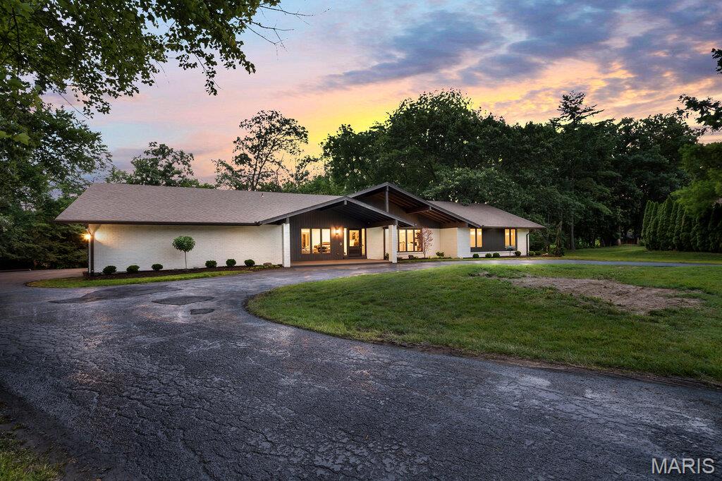 Welcome to this stunning, fully remodeled ranch home  with a huge 4 car garage nestled in the highly sought-after Meadowbrook Country Club community. Offering 5 spacious bedrooms and 3.5 beautifully updated bathrooms, this exceptional home blends timeless style with modern luxury. The open and inviting floor plan showcases vaulted ceilings, original millwork, an updated kitchen with quartz tops, stainless appliance, 36" gas range, designer fixtures, and thoughtfully renovated living spaces throughout. The finished lower level provides 2 bedrooms, spacious walk-in closets,  room to entertain, relax, or accommodate guests with flexible living space and ample storage. Whether you're hosting gatherings or enjoying quiet evenings at home, this move-in-ready property offers comfort, sophistication, and effortless living in one of the areas most desirable neighborhoods.