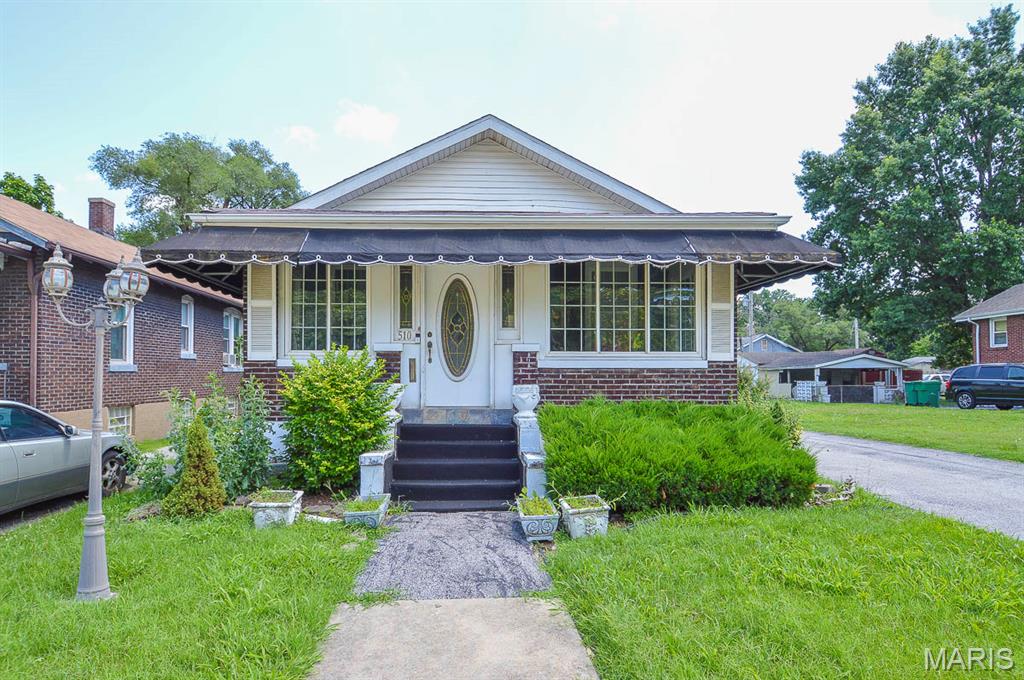 Price listed is Starting Bid Only. Bidding starts closing 7/16/2026 @ 5:30 p.m. Opportunity awaits at 510 N. 29th Street in East St. Louis! This charming full-brick home is situated on a 0.11± acre lot in the established Winstanley Park subdivision. The home features two bedrooms that share a full bathroom. The spacious living room is anchored by a decorative fireplace and showcases original hardwood flooring, adding character and warmth throughout the space. The eat-in kitchen includes all appliances and provides access to a versatile bonus room that is ideal for a home office, family room, or flex space to fit your needs. An enclosed front porch extends the living area and offers year-round enjoyment. The full basement provides ample storage and offers the potential to expand the home's livable square footage. A three-quarter bathroom is already in place, creating additional possibilities for future finished living space. Exterior improvements include a detached two-car garage and an asphalt driveway. Conveniently located near local schools, shopping, dining, and major transportation routes, this property presents an excellent opportunity for homeowners and investors alike. Whether you're looking for a primary residence or an income-producing property, this home offers plenty of potential.  Property will sell under auction terms and be sold AS- IS, WHERE-IS. Seller, will not make any repairs as a result of any building, occupancy, or environmental inspections. Buyer will be required to sign an Auction Purchase & Sale Agreement if final bid is accepted by Sellers.