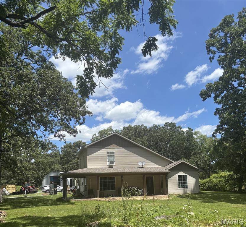BEAUTIFUL Hobby Farm just south of Farmington! This incredible 25-acre property features 18 acres of fenced pasture and a stunning 6-year-old home with 3 bedrooms and 2.5 baths. ENJOY the picturesque spring-fed pond and an impressive collection of outbuildings, including a 35 x 45 insulated shop with 200-amp service, HVAC, and an automotive lift; a 50 x 60 hay barn; and a 60 x 80 livestock barn complete with horse stalls, corral, loading chute, and Priefert Rancher head gate. Whether you're raising livestock, enjoying horses, or simply looking for the perfect country escape, this exceptional homestead has everything you've been dreaming of. Don't miss this rare opportunity to own a turnkey hobby farm in picturesque St. Francois County!