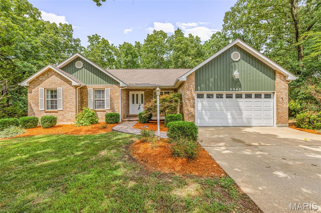 Welcome home to this beautiful 4-bedroom, 3-bath ranch nestled among the trees in a picturesque golf course community! With the golf course just outside your front door, this home offers the perfect blend of peaceful surroundings and resort-style living. Inside, you’ll love the bright, open floor plan featuring cathedral ceilings, a cozy gas fireplace, six-panel doors, hardwood floors and a warm rustic charm throughout. The spacious kitchen offers granite countertops, 42" custom cabinets, stainless steel appliances, breakfast bar, double pantry cabinets, and plenty of cabinet space, along with a separate dining area that’s perfect for entertaining. The primary suite features a private bath with double vanities and a walk-in closet, while the convenient main-floor laundry adds everyday ease. The finished walkout lower level provides a second primary suite, possible 5th bedroom, large recreation area with endless possibilities for family gatherings, hobbies, or game nights. Step outside onto the spacious deck overlooking a private, wooded backyard—the perfect place to relax and enjoy nature. The amenities truly set this home apart! Enjoy a welcoming, family-friendly community offering four lakes for fishing and recreation, a community beach with seasonal food trucks, campgrounds, pickleball courts, and a country club featuring an 18-hole golf course, swimming pool, fitness center, and restaurant. All of this with a charming small-town feel while remaining just minutes from shopping, dining, and everyday conveniences. This home offers more than just a place to live—it’s a lifestyle you’ll love!