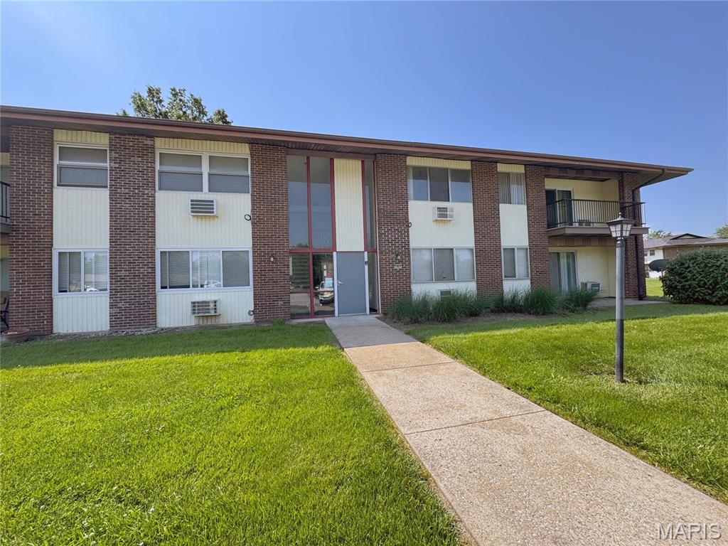 Welcome to this move-in ready, second floor condo with a view of lots of green space. You'll love the bright open feeling of this home as soon as you walk in. There's a very large living room that connects to the kitchen with a pass through window. The kitchen features new cabinetry and a breakfast bar. From the kitchen you can access the balcony and enjoy a morning cup of coffee. From the balcony, there are also sliding glass doors as a second access way to the primary bedroom. Across the hall you'll find a second bedroom with plenty of space. There are two hallway closets that provide bonus storage space. The hot water heater and window units are about 1 year old.  The building includes a laundry room for your convenience. Please confirm schools. To view a virtual tour, please visit: https://my.360tourlink.com/7fc87f34-b5b2-4235-add8-4397f4af7ccc?type=unbranded