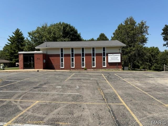 Versatile Church &  R1E Property on Nearly 2 Acres!  Property could be used for residential with acreage to build or sell off for building. Total square footage unknown. 
Discover a unique opportunity in St. Peters with this well-positioned property offering nearly 2 acres of land, a spacious parking lot, green space, and a small playground. The existing building provides a versatile layout and could be an excellent fit for a variety of uses, including a church, school, daycare, preschool, community center, or other institutional or educational use, subject to applicable zoning requirements and approvals.
Located in unincorporated St. Charles County and zoned R1E, the property offers a combination of an existing building, ample parking, open outdoor space, and a playground area—making it an appealing option for an organization looking for room to operate, grow, and serve the community.
The nearly 2-acre site provides valuable outdoor space and flexibility that is increasingly difficult to find. Whether you're looking to establish a school, church, daycare, educational facility, community organization, or other compatible use, this property is worth exploring. Property is being sold AS IS.
Conveniently located in the St. Peters area, 49 Circle Way offers a rare opportunity to purchase a substantial property with an existing facility, parking, green space, and the potential to create a space tailored to your organization's needs.
Property Highlights:
Nearly 2 acres
Existing church building
Spacious parking lot
Green space
Small playground
Located in unincorporated St. Charles County
R1E zoning
Multiple potential uses, subject to zoning and county approval
Convenient St. Peters location

Bring your vision and explore the possibilities at 49 Circle Way, St. Peters, Missouri.
Duplicate of MLS # 26052036
