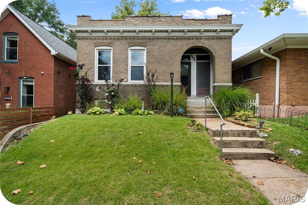 Step into this beautifully updated 1909 Carondelet gem -- a perfect blend of modern convenience and timeless character. This three bedroom, one bath home welcomes you with spacious rooms, high ceilings and warm hardwood floors throughout. The original fireplace mantel anchors the living room. Pocket doors and a built-in hutch/dresser in the primary bedroom are just a few of the other charming elements throughout this home. The large eat-in kitchen boasts loads of cabinetry and newer appliances and the stylish bathroom is equipped with two linen closets. The windows are newer and and the roof is new in 2025 for added peace of mind! Out back, enjoy a covered deck and a generous-sized, fenced back yard -- perfect for hosting BBQ's with family and friends. Located just minutes from Highway 55 and steps from Carondelet Park, this home offers the best of city living and old world charm.