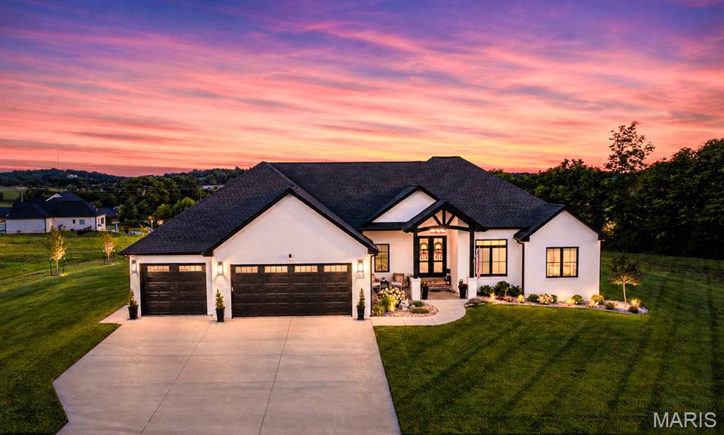 Welcome to a home where luxury meets effortless living. Thoughtfully designed with impeccable craftsmanship and curated finishes throughout, the extraordinary estate offers elegance, comfort and every luxury amenity imaginable.
From the moment you step inside, you'll appreciate the warmth of the stunning white oak hardwood floors, soaring ceiling and light filled space for both entertaining and family living. The gourmet chefs kitchen is exceptional, featuring premium Jenn-Aire Appliances, a separate full size Frigidaire fridge and freezer, exquisite Cambria quartz countertops, pot filler, Buessink custom cabinetry with a beautifully appointed butlers pantry complete with additional convection oven and microwave-making hosting effortless. 
The open concept is anchored by a gas fireplace, while the finished lower level offers a second living space with custom, handcrafted built entertainment bar making it the ultimate destination before walking out to your stunning pool space. 
Outdoor living is nothing short of spectacular. Covered Deck from main level overlooking your oasis of pool, tanning ledge, expansive covered patio, fruit trees and fenced area designed for relaxation and entertaining. 
Main level also includes a dedicated office, inviting breakfast nook overlooking the backyard. Additionally, you'll find 3 spacious bedrooms, including the luxurious primary suite with walk in closet and walk in shower, soaking tub and dual sink in white oak vanity.
More practical luxury continues through the home with Hunter Douglas automatic electric window covering, water softener, abundant storage and a heated and cooled John Deere room that offers endless flexibility. The area already offers a finished half bath with access to the pool for ultimate convenience for pool guests.
EVERY detail of this home has been thoughtfully selected and meticulously maintained. This is more than a home-it's a lifestyle for those who expect the very best.