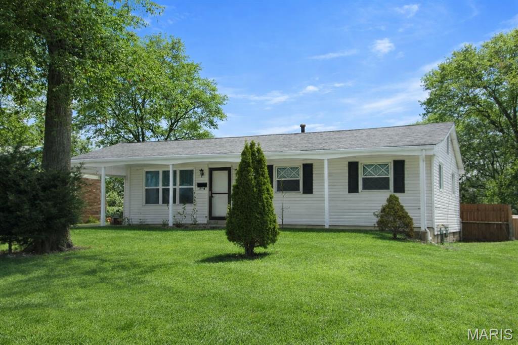 1160 square foot ranch style home with lots of updates including new roof, new gutters, newer electrical panel, updated HVAC system and water heater newer windows. There is a new double sliding glass door leading out to a lovely back yard with a new privacy fence and a shed for storage.  Original hardwood flooring EXCEPT kitchen and bathrooms, recently replaced kitchen flooring and updated bathrooms including marble flooring.  Covered front porch allows for seating and decoration and there is a covered carport with direct entry to home. Full, DRY unfinished basement. ALL appliances included!  With a one year home warranty  to give you peace of mind! NEAR PARK TO ENJOY THE OUTDOORS!!