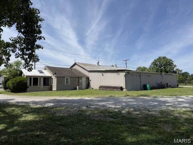 Exceptional commercial opportunity in the heart of Carlinville. This versatile property offers over 4,000 square feet of flexible space ideal for a small business, warehouse, workshop, or storage operation. Situated on 0.87-acre lot with convenient access from North Broad Street, the property is designed for functionality and accessibility.
Features include two dock doors for efficient loading and unloading, ample room for equipment or inventory storage, and an additional finished area that can serve as office space, living quarters, or a showroom. The central location provides excellent visibility and easy access for customers, employees, and deliveries alike.
Whether you are investing in commercial property, or seeking a multi-use facility with growth potential, this property offers unique possibilities in a great community.  Don’t miss this opportunity.