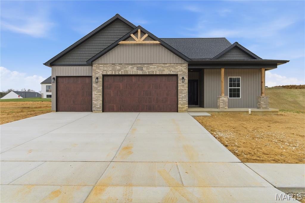 This upgraded Brynn model is a 1,697 sq ft ranch with an open floor plan and 3 car garage with an extra deep 3rd bay. When you walk through the front door you will notice 9' ceilings throughout the main floor.  The spacious vaulted family room features a wood burning fire and ceiling fan which is open to the chef's kitchen with an oversize island, granite counter tops, and stainless steel appliances. The giant walk-in pantry has a separate ice maker line for an additional refrigerator, built in cabinets, and plenty of wire shelving.  There are two spacious bedrooms both with ceiling fans and a bathroom as you enter the front door. The owner's suite features a tray ceiling, ceiling fan, and bathroom with a double bowl vanity, large walk-in closet, separate shower with glass shower door, and tub. There is a main floor laundry with a slop sink. You will notice can lights throughout, overhangs around the entire home, and coach lights on the garage.  Downstairs there is plenty of room for finish, with a full rough-in and egress window.  The front and side yards will be sodded.  Don't miss out on this great property!