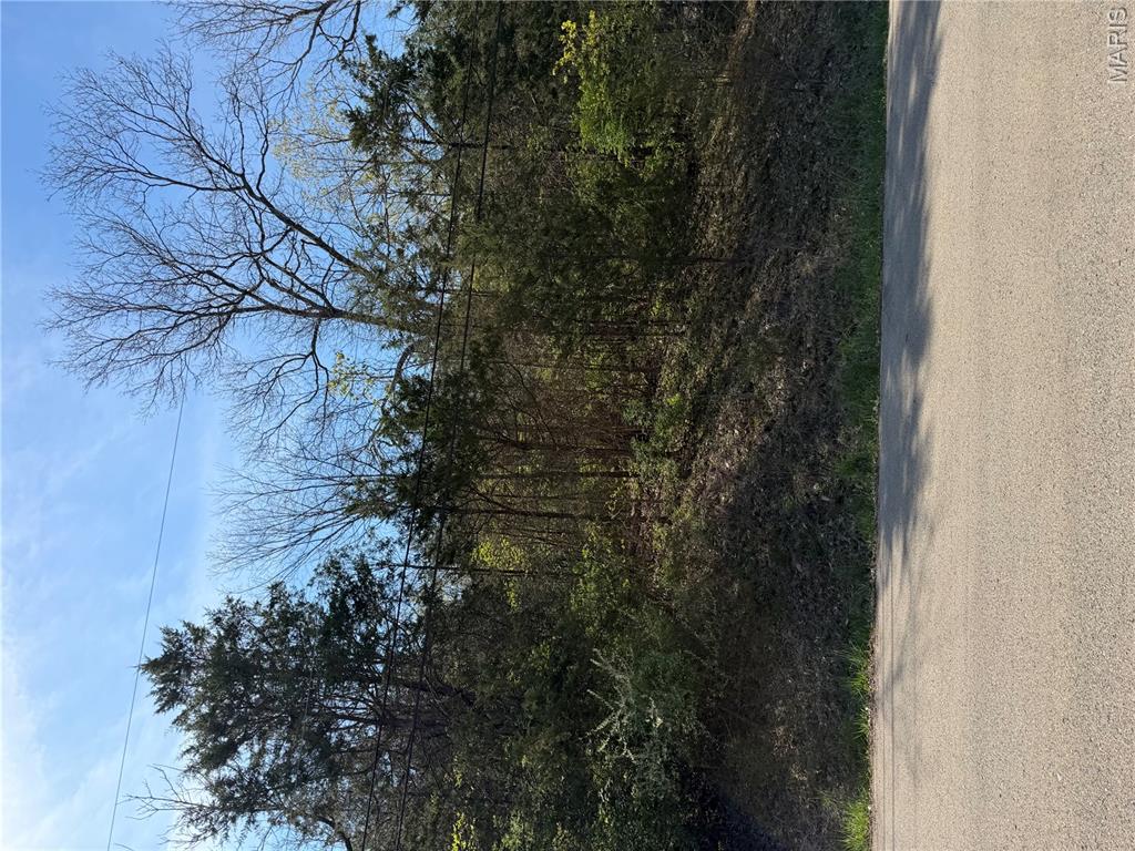 Amazing Building Lot in Terre Du Lac on the Skyview Golf Course and Lake View of Lac Marseilles  Paved road.  Beautiful building spot.