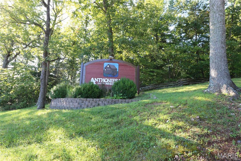 2 +/- Acre WATERFRONT lot at Anthonies Mill Resort NOW AVAILABLE!  Build your new home overlooking the lake and build your own waterfront dock surrounded by the beauty of the rolling hills in this part of the country! This sloped lot was prepared for a walk-out basement home overlooking the lake and sheltered from the road via an easement access from the side rather than the top of the property.  Join the private, gated community and all that Lake Life has to offer... skiing, boating, fishing tournaments, and community events for the holidays!  The community includes a Member pool overlooking the lake, a sandy beach for volleyball, paddleboard docking, an inflatable bounce dock for lake play, and tennis/basketball courts for additional entertainment.  Just over an hour from St. Louis and only 15 minutes off the interstate...make time to see this listing today!