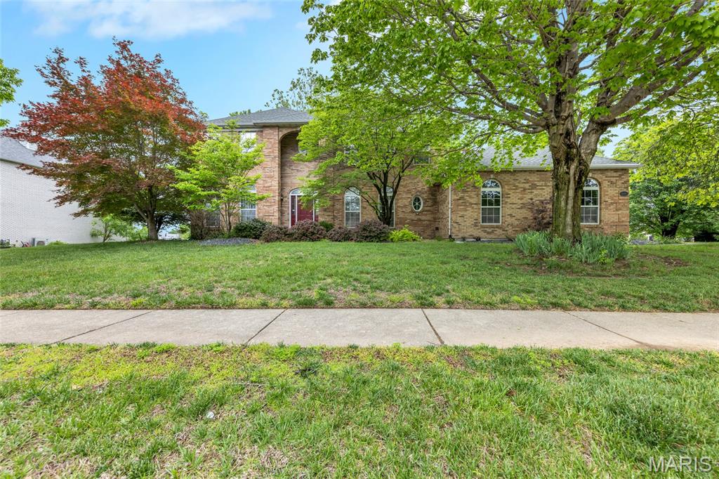 Prepare to be impressed from the moment you arrive! This stunning 5 bedroom, 4.5 bathroom brick front home set against the backdrop of breathtaking golf course and lake views is truly a rare find in Fairview Heights. With its beautiful brick exterior, extensive landscaping, and mature shade trees creating incredible curb appeal, this home makes a lasting first impression before you ever step inside.
The thoughtfully designed main level offers an elegant and functional layout perfect for both everyday living and effortless entertaining. The formal dining room sets the stage for memorable gatherings, while the spacious living room provides a comfortable retreat for relaxing. The stunning family room is an absolute showstopper, featuring a bay window that frames the gorgeous views, a cozy fireplace, and a wet bar — everything you need to host in style. The huge kitchen has been beautifully updated with new flooring, countertops, and fresh paint, and comes complete with all appliances, a cheerful breakfast area, a convenient built-in desk, and sliding doors that open to the expansive deck — the perfect spot to soak in the breathtaking lake and golf course views right from your own backyard. A dedicated laundry room rounds out the main level with added everyday convenience.
Head upstairs to discover the luxurious primary bedroom suite, complete with a generous walk-in closet and a private attached bathroom. Three additional spacious bedrooms and two full bathrooms complete the upper level, providing plenty of comfortable accommodations for family and guests alike.
The walk-out lower level is an entertainer's dream, boasting a sprawling rec room perfect for game days, movie nights, and gatherings of all kinds. A fifth bedroom, full bathroom, and ample storage area round out this incredible space, ideal for guests, a home office, or a private retreat.
Step outside and experience the true magic of this property, the spectacular deck overlooks the serene lake and lush golf course, creating a picture perfect setting for morning coffee, evening cocktails, and everything in between. The mature shade trees and professionally landscaped grounds only add to the tranquil, resort like atmosphere.
Additional highlights include a transferrable golf membership fee, water softener, and a brand new roof for added peace of mind!