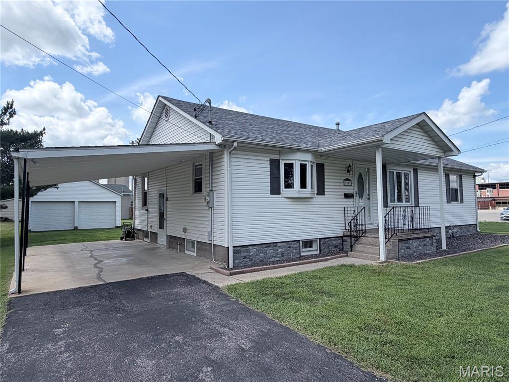 One time listing to be used for comp purposes only.
This bungalow is a 3 bedroom, 1 full bathroom, and 1 half bathroom that also houses the laundry.  There is wood flooring in the living room and 2 bedrooms.  There is a partial basement that measures 30x27.  The home was recently updated.  There is a detached 2 car garage and on the back side of the garage there is an additional space with a small garage door that could house a lawnmower. They are not connected and that part measures 20x12.