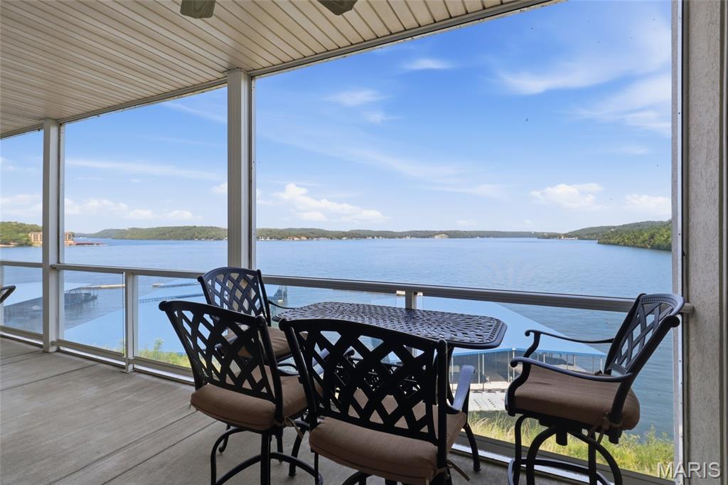 This is the Lake of the Ozarks lifestyle you've been waiting for! Enjoy breathtaking main-channel views at the 31MM from this beautifully remodeled 3BR/3BA Trinity Pointe condo. The wide-open kitchen and living area was made for entertaining, featuring custom cabinetry, newer appliances, striking quartzite countertops, stylish lighting, LVP flooring and a gas fireplace. Step onto the spacious screened deck and picture morning coffee overlooking the water. The primary suite captures gorgeous lake views and features a walk-in closet, dual floating vanities and walk-in shower. Best of all, the TOTAL LAKE PACKAGE is now included: a 12x36 boat slip PLUS 2 covered PWC slips with lifts! Need more room for your boat? An additional 16x44 slip is available for $25,000, or purchase it with a hoist for $35,000 additional. Elevator access makes trips to the pool, clubhouse and waterfront easy. Conveniently located minutes from Camdenton by land and near Larry's on the Lake, Fish & Co. and The Cave by water. Luxury, views and lake access come together here—make Trinity Pointe your place to escape, entertain and make unforgettable memories! Wave-protected community docks add peace of mind today!