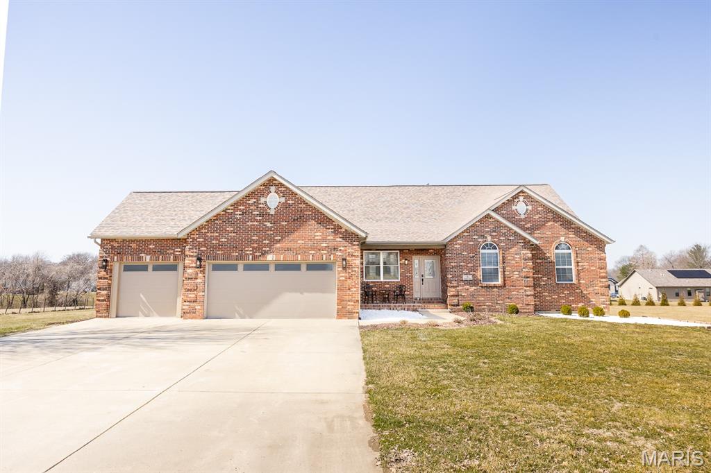 Situated on 3 acres in Glen Carbon, every detail has been thought of in this GORGEOUS, COMPLETELY RENOVATED home! Upon entry, you'll fall in love with the fresh, neutral color palatte, soaring ceiling, and wall of windows. The main floor features a spacious living room with cozy fireplace that opens to the gorgeous custom kitchen and separate formal dining room. The kitchen has all NEW STAINLESS APPLIANCES, BEAUTIFUL NEW CUSTOM SOFT CLOSE CABINETRY, QUARTZ COUNTERS, TILE BACKSPLASH, WINE FRIDGE, 2 pantries and breakfast bar. Down the hall you'll discover 2 spacious bedrooms with walk in closets, main bathroom (NEW VANITY+FIXTURES with QUARTZ COUNTER & TILED SHOWER), and stunning primary suite. The primary bedroom features a vaulted ceiling, custom walk in closet, and the most beautiful en-suite bathroom (NEW SOAKING TUB, VANITY, TILE, RAIN SHOWER). Before venturing to the basement, you'll just have to step outside to the ALL NEW DOUBLE-TIER MAINTENANCE FREE DECK. Morning coffee, BBQ's in the summer - this deck was made for using. The huge finished basement features a second living room with gas fireplace, wet bar with quartz counter, tile backsplash, and plenty of space for seating, additional area for dining table, pool table, or whatever you can think of - can we say entertainer's dream?  You'll also find the 4th bedroom and 3rd full bathroom. And you guessed it - gorgeous and newly renovated featuring NEW VANITY+FIXTURES & TILED RAIN SHOWER.  Can you even imagine owning this stunning 3-SIDES BRICK HOME on 3 ACRES in Glen Carbon?  You'll love all the space to spread out (in and outdoors!) while also being only 5 minutes to Walmart, Anderson Hospital, more shopping and restaurants than there is space to list, and approx 30 minutes to Lambert Airport.  *Additional notable features of this incredible home include: NEW SIDING 2025, MAINTENANCE FREE DECK 2025, WATER HEATER 2021, HVAC 2026, ROOF-10YRS, NEW LVP FLOORING, NEW FIXTURES & FAUCETS. Property is not governed by an HOA, only by building and zoning regulations of Village of Glen Carbon- for any inquiries on what can be built/added reach out to Village of Glen Carbon.  Make this home yours before it slips away!  Home is agent owned.