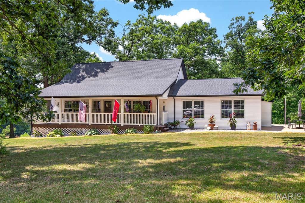 Properties like this rarely become available. Set on 37 unrestricted acres in the heart of St. Charles County, this extraordinary estate offers a level of privacy, flexibility, and opportunity that buyers search years to find. Whether you're dreaming of a multi generational family compound, a private retreat, a home based business, hobby farm, equestrian property, or the ultimate place to store your boats, RVs, classic cars, tractors, and recreational equipment, this property is designed to accommodate it all.

Perfectly positioned off Highway T in Marthasville and located within the highly sought after Francis Howell School District, the possibilities are truly endless. The impressive 70 x 52 insulated outbuilding is a standout feature, complete with 2 large lean tos for additional covered storage and a separate 2 bedroom, 1 bathroom living quarters ideal for extended family, guests, employees, or rental income.

The main residence has been thoughtfully updated with a complete exterior renovation including a new architectural roof, new siding, new gutters, and an inviting covered front porch with finished soffit ceiling. Inside, you'll find a beautifully maintained 1.5 story home featuring an open floor plan with vaulted ceilings, updated lighting, fresh interior paint, and an abundance of natural light. The spacious kitchen offers freshly painted cabinetry, butcher block countertops, a tiled backsplash, under cabinet lighting, and generous workspace for everyday living or entertaining.

2 spacious bedrooms, a full bathroom, and quality natural wood doors and trim complete the main level, while the upper level features a private bedroom suite with its own full bathroom. The partially finished lower level provides additional flexible living space perfect for a home office, fitness room, recreation area, or guest accommodations.

Additional highlights include an oversized insulated 2 car garage with a new insulated garage door and a detached garden shed that could easily serve as a workshop, storage building, or chicken coop.

This is far more than a home. It is a legacy property offering space, freedom, and endless possibilities in 1 of the area's most desirable locations. Opportunities like this are exceptionally rare. Schedule your private tour today.