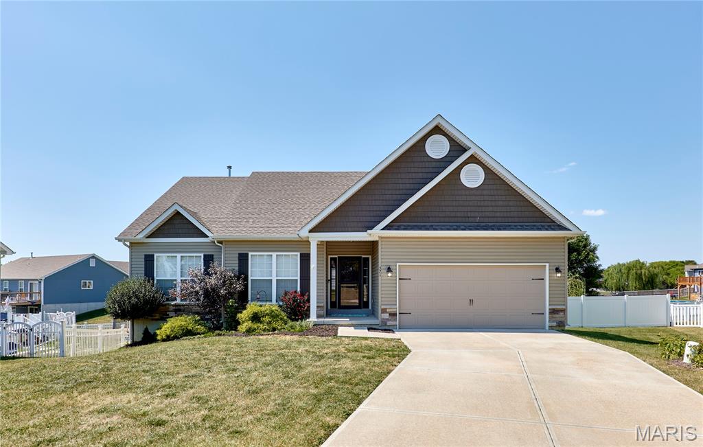 LOCATION, SPACE & ONLY 5 YEARS NEW! This spacious 1,882 sq. ft. (On Main Floor) ranch offers 5BR/2BA, a convenient location close to town, and fantastic indoor and outdoor living space! The main level features 9' ceilings, an open floor plan, recessed lighting, abundant windows for natural light, a large entry foyer, and main-floor laundry. The kitchen offers staggered cabinetry, abundant storage, a walk-in pantry, center island, and breakfast bar. The spacious primary suite features a large walk-in closet and private bath with dual sinks, soaking tub, separate shower, and plenty of natural light. Generously sized main-floor bedrooms include ceiling fans and large windows, while the hall bath offers dual sinks. The lower level adds two additional bedrooms, both with egress windows and large walk-in closets—perfect for family, guests, office, or hobby space. Outside, enjoy an impressive 50'x10 deck with awning, spanning the back of the home, vinyl privacy-fenced backyard, raised garden beds, and fruit trees. So much space inside and out—come see everything this home has to offer! Builder 10 Year Warranty remaining.