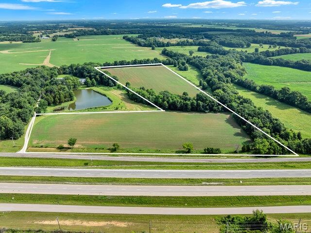 Prime Development or Investment Opportunity!
This 22+/- acre tract offers over 1,000 feet of Interstate 70 frontage, excellent visibility, and direct access to growth corridors. Located within a designated Opportunity Zone, this property presents major tax advantages for investors or developers.

The land is mostly level and tillable, making it ideal for agricultural use, commercial development, or potential subdivision. Electric is already on site, and USDA financing options may be available. Whether you're looking to build, farm, or hold for future appreciation, this high-exposure property checks all the boxes.