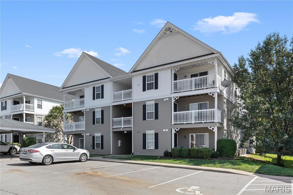 Have you been searching for a something in a growing community with a highly coveted school district?  You're in luck!  Look no further than this beautifully renovated top-floor condo in O’Fallon!  You’ll love the open layout of the main living space; with vaulted ceilings, luxury vinyl plank flooring, and freshly painted walls across every piece of drywall.  The dining room has a breakfast bar with a view into the kitchen, where you’ll have 42” cabinets, brand-new stainless-steel appliances, and a perfectly selected backsplash that accentuates the floor throughout the home. The expansive living room leads to the covered balcony and convenient storage room.  Vaulted ceilings continue into the primary bedroom, which also features an updated bathroom with a properly sized vanity, as well as your attached and spacious walk-in closet built to hold all of your clothes (which is everything from every season because it's Missouri).  You’ll have convenient in-unit laundry (with a brand new washer and dryer), plus covered parking and additional space for guests.  Another bedroom and full bathroom complete the space that you can potentially call your home.  Enjoy all of the amenities of the Springhurst community: pool, playground, pond, dog park, walking paths, and a basketball court while being just moments from highways, shopping, restaurants, and of course the schools.  Don't miss out on this one!