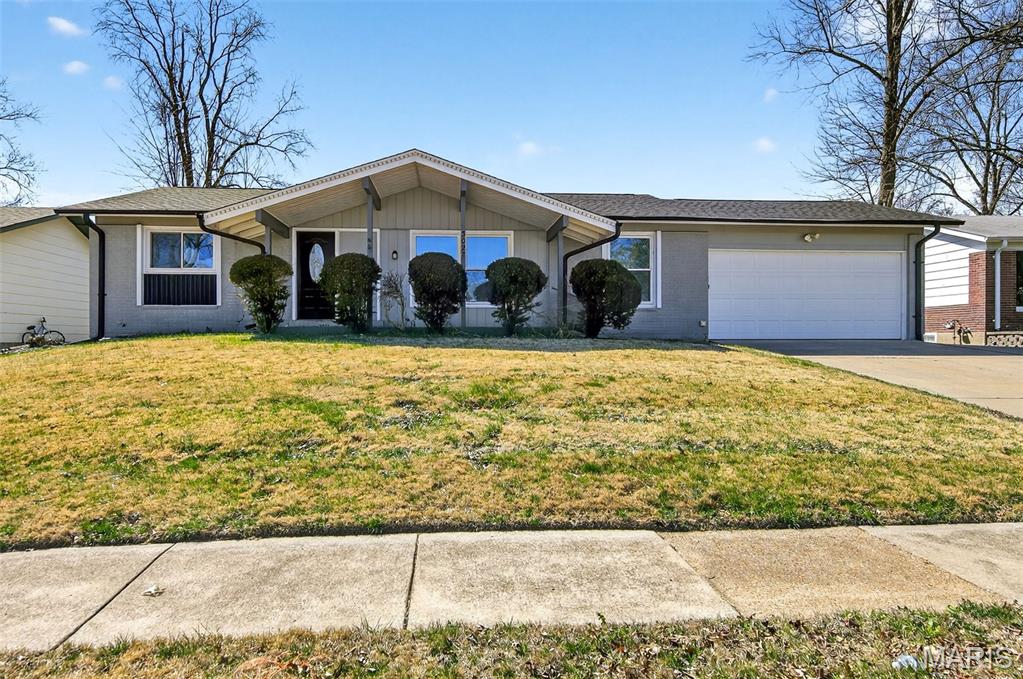 This charming ranch-style home with approx. 1,580 sq. ft. living area in the Wedgwood subdivision of Florissant offers a spacious and functional layout featuring 4 bedrooms and 2 full bathrooms. The inviting main level has hardwood flooring throughout the living and dining rooms, leading into a cozy family room centered around a classic wood-burning fireplace with direct access to the outdoor patio and backyard. The kitchen provides ample cabinet storage. The basement provides a significant amount of additional space with a recreation room, laundry area, and plenty of storage, all complemented by an attached two-car garage. This residence combines traditional character with the ease of single-story living.