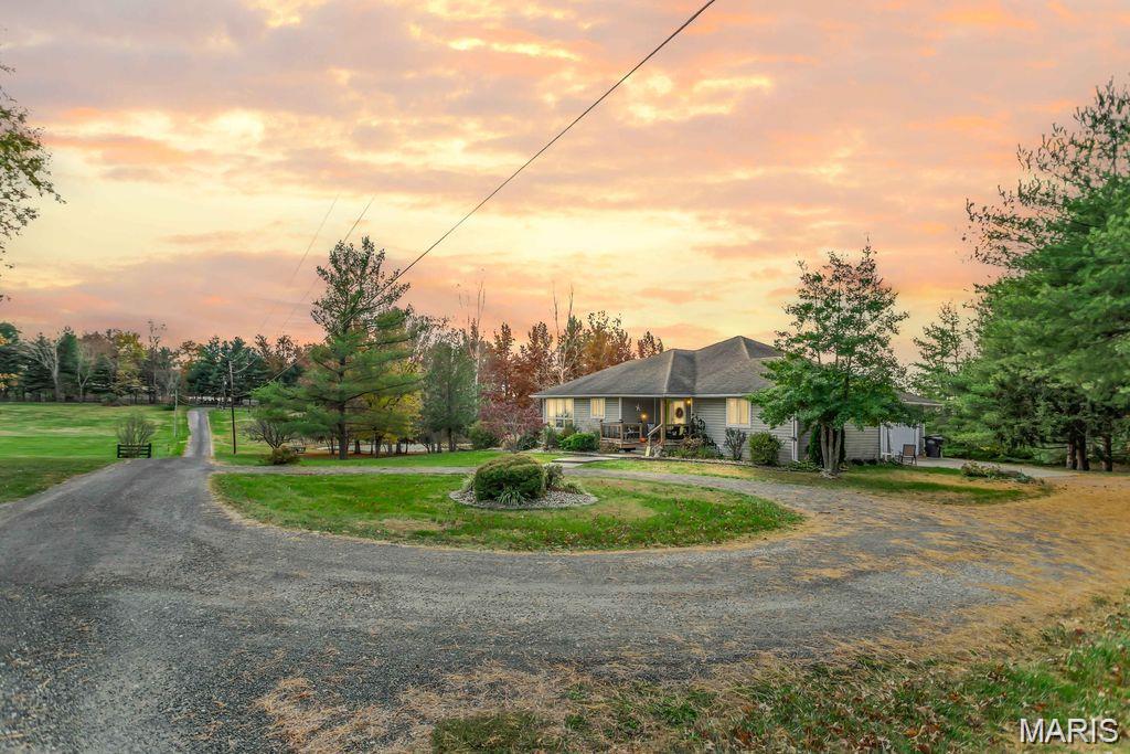 Beautiful 2 acre property in Bethalto School District, just on the outskirts of town!  This 4bed/3.5 bath has all the space you want and need for your family to spread out, inside and outside!!  Whole house has just been professionally painted and is completely move-in ready!  You will love the inviting feeling of this home the moment you step on the front porch!  Inside you walk in to a nice foyer with hardwood floors.  Large kitchen with plenty of cabinetry that opens to the dining room and living room.  The main floor primary bedroom suite is very spacious with a full bathroom, walk-in closet and a private balcony looking over the park-like view of the backyard.  Along with the second main floor bedroom with attached full bath, you will find the main floor laundry room and a half bath.  The lower level offers 2 more spacious bedrooms with large closets, along with a family room and wet bar, full bathroom and large storage room.  You will love having access to the backyard with walk-out access.  Great property with plenty of space for entertaining or just being outside and enjoying the natural surroundings!  A bonus to this property is the 20x33 oversized garage, along with the attached 2 car garage.  Be sure to schedule your private showing soon!
**Whole house has been professionally painted, hardwood floors refinished, new vanities, tub reglazed and carpets stretched.