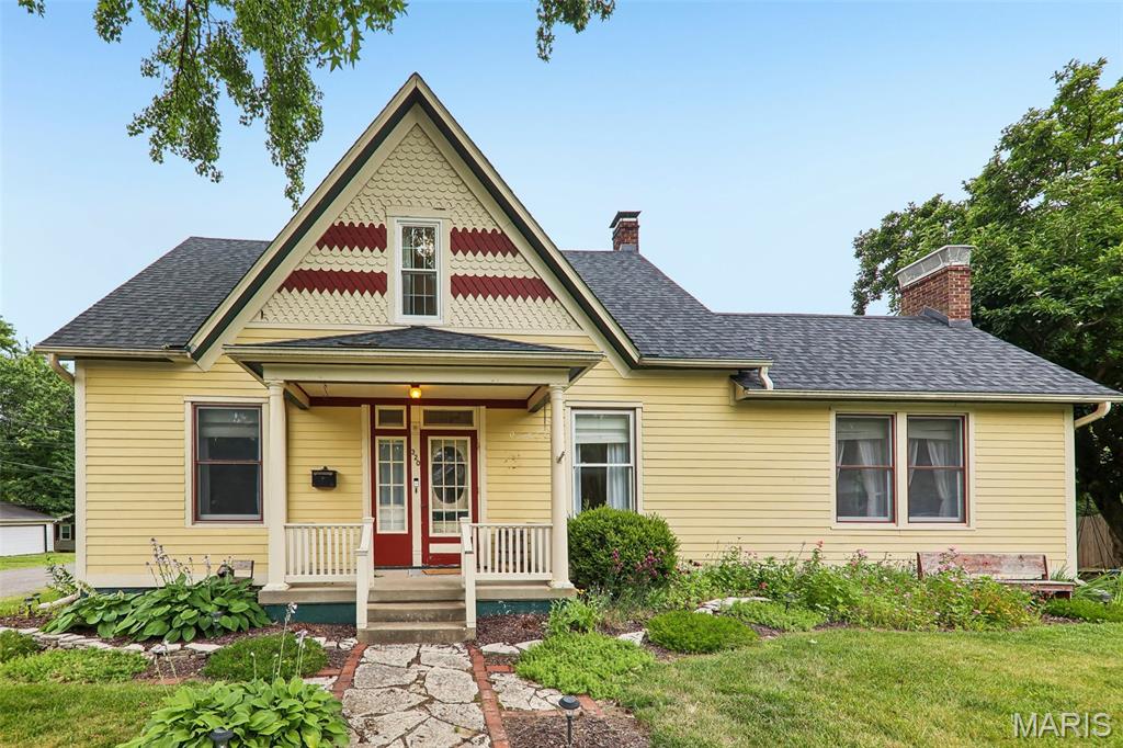 They stopped building homes like this in 1905. The original hardwood floors that have absorbed 120 years of Sunday mornings. The wood-burning fireplace that makes January feel like a choice, not a punishment. This is the kind of Victorian that people slow down to look at on their way through Trenton — and now it can be yours. Step into a brick-paved courtyard lined with raised flower beds and strung with lights overhead, and you'll understand immediately why this home doesn't just get visited — it gets remembered. Five bedrooms across three levels give you room to breathe. A newly renovated kitchen (2025) anchors the main floor alongside a dining room, family room, living room and a main-level primary suite. The big worries? Already handled. Roof is approximately four years old, upstairs windows are new, appliances updated in 2022, washer and dryer brand new in 2025 — every system meticulously maintained so you inherit the charm without the headaches. On a quiet corner lot two-tenths of a mile from the elementary school, mornings here are unhurried. This one is turn-key — without sacrificing a single inch of the character that makes it irreplaceable.