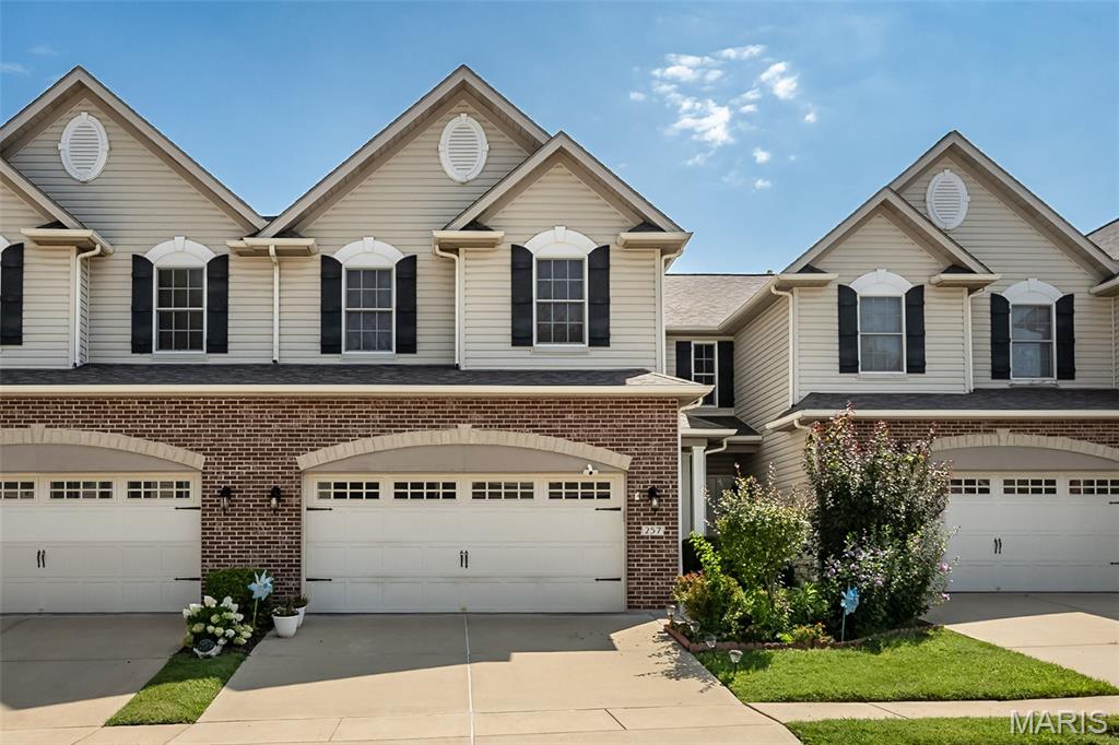 Stunning 2 BD, 3.5 BA interior unit townhome ideally situated on a beautiful cul-de-sac lot backing to mature trees in the desirable St. Andrews neighborhood! With the finished lower level, this home offers 2,484 SF of finished living space in a peaceful, tree-lined setting. The main level features wood flooring, 9' ceilings, a dramatic 2-story Great Room with a wall of Anderson windows overlooking the wooded yard for plenty of natural light! The kitchen shines with raised-panel cabinetry with crown molding, island with breakfast bar, quartz countertops and stainless steel appliances. A main-floor laundry is great for convenience. Above, a spacious Primary Suite boasts a coffered ceiling, raised-height vanities, Separate soaker tub and shower, and a walk-in closet. A second bedroom, hall bath, and a spectacular loft with wood flooring complete the upper level. The finished lower level includes a Family/Rec Room, flexible-use area and full bath, plus walkout access to the patio. Elegant exterior with brick and stone detailing, address stone and low-maintenance composite deck. Monthly association fee includes lawn care, landscaping, irrigation, snow removal, select exterior maintenance and some insurance per the Indentures. Enjoy nearby walking trails and convenient access to Hwys 70, 370 and 364.