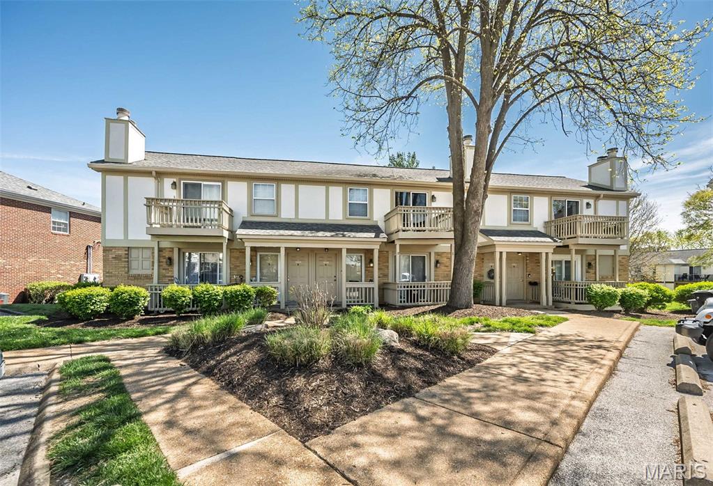 Welcome to 1450 Bluebird Terrace! This top floor walk-up unit certainly isn't the ordinary ~ it's hands down "extra"ordinary! 
The open concept floorplan has been beautifully updated throughout and exudes unparalleled style, class and artistic flair. Be greeted by the soaring vaulted great room (11' ceilings) that offers an attractive focal fireplace (woodburning) with custom designed stone/wood facade, ample dining area with chic chandelier and easy access to the front deck (1 of 2!). The magazine worthy kitchen is simply GORGEOUS! Designer light maple wood cabinetry (by Holiday Kitchens), unique granite countertops, abstract tile backsplash and Whirlpool appliance package (stack washer/dryer included!). The primary bedroom is quite serene: board and batten accent wall, neutral carpet (2023) and a large double closet. Bedroom #2 is nicely sized and offers generous closet space and private access to the back deck that overlooks beautiful greenspace. The well appointed bath (2020) has oversized cabinet vanity and tub/shower combo. Storage is not an issue: (2) large interior closets (1 is walk-in) and (1) large exterior. NOT TO MISS: Brentwood Forest's (2) pools, clubhouse, convenient mid-town location offering fabulous restaurants, shopping, schools and more! PLEASE NOTE: ****BONUS****Seller has PAID IN FULL the Special Assessment for 2026! Also...Did you hear the GREAT NEWS? Brentwood Forest has been REAPPROVED for Fannie Mae Lending!!! That is WONDERFUL news for all you Buyers out there! Talk to your Agent/Lender and come check out this FABULOUS condo!
