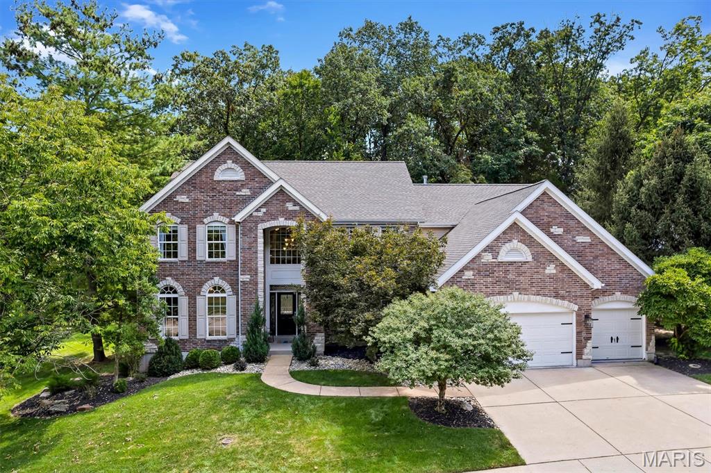 Exceptional Luxury Living in a Premier Setting

Stunning 2-story residence offering approximately 5,100 sq. ft. of sophisticated living space with 4 bedrooms, 3.5 baths, and a 3-car garage, beautifully situated on a nearly half-acre wooded lot in the highly desirable Rockwood School District. A dramatic 2-story entry welcomes you into the spacious great room, featuring soaring windows, a gas fireplace, and serene views of the private wooded backyard. The main level showcases elegant coffered and vaulted ceilings, a formal dining room, and a private office with custom built-ins.

The gourmet kitchen is the heart of the home, appointed with 42-inch custom cabinetry, granite countertops, gas cooktop, oversized center island, and walk-in pantry—ideal for everyday living and effortless entertaining. The main-floor primary suite offers a luxurious retreat with a generous walk-in closet and spa-inspired bath featuring a separate soaking tub and shower. Main-floor laundry adds convenience and functionality.

Upstairs, three additional bedrooms, two full baths, and an expansive bonus/recreation room provide exceptional flexibility for family, guests, work, or entertainment.

The partially finished lower level adds valuable additional space and is currently utilized as a dedicated workout/fitness area. Rough-in plumbing for a future bathroom provides excellent potential for additional finished living, recreation, or entertainment space.

Additional highlights include a stylish wet bar, zoned HVAC, sprinkler and security systems, and an exceptional blend of thoughtful design and everyday comfort. Outside, enjoy the privacy and tranquility of the nearly half-acre homesite backing to mature woods.

Beautifully appointed and thoughtfully designed, this exceptional residence offers generous space, refined details, and a private setting in one of the area's most sought-after school districts.