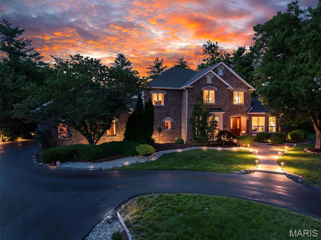 Some homes make an impression. Others leave one.

Tucked away at the end of a quiet cul-de-sac, 845 Coulange Court is a home where thoughtful design and natural beauty exist in harmony. Set on nearly one acre within a designated bird sanctuary, this custom residence offers more than 5,500 square feet of living space surrounded by mature trees, abundant wildlife, and a sense of peace that is increasingly rare to find.

From the moment you step inside, the home reveals its most remarkable quality: scale. A soaring two-story marble foyer opens to a breathtaking great room where vaulted ceilings rise overhead, and a dramatic wall of windows fills the space with light. The effect is immediate. Everyday life feels just a little less ordinary. 

As impressive as the architecture is, it is the details that leave the lasting impression. Finished-in-place hardwood floors, custom cherry inlays, oversized doors, custom millwork, built-ins, and carefully selected materials create spaces that feel substantial and enduring.

The kitchen was designed for the way people actually live. Anchored by a distinctive oversized butterfly island and surrounded by custom cabinetry with cherry accents, it offers the warmth and functionality that naturally draw people together. This is where meals are prepared, conversations linger, and guests inevitably gather.

Nearby, the family room invites you to slow down. Beneath a cathedral wood ceiling, a stone fireplace anchors the space while custom built-ins add warmth, character, and a place to showcase memories. French doors extend the living area outdoors to a stamped concrete patio suited for quiet mornings, family celebrations, and evenings spent beneath the stars.

One of the home's most distinctive spaces is the office. Framed by custom cherry built-ins, a wet bar, and a dramatic turret-inspired wall of windows, it offers a rare combination of inspiration and retreat. Whether focused on the task at hand or enjoying a quiet moment at the end of the day, it is a space designed for both reflection and forward thinking.

The primary suite is generous in scale yet warm in character, featuring ten-foot ceilings and hardwood floors with custom inlay details. The adjoining bath features an oversized jetted tub, expansive shower with glass block accents, hammered copper sinks, and a custom walk-in closet designed to support both function and luxury.

Outside, the sanctuary setting takes center stage. A welcoming U-shaped driveway leads to an oversized side-entry three-car garage, while mature trees and established landscaping create a sense of privacy rarely found today. Surrounded by birdsong and the changing rhythm of the seasons, the property offers a peaceful retreat that feels wonderfully removed from the pace of everyday life.

In the end, what makes 845 Coulange Court unforgettable is not simply its scale or craftsmanship, but the way it makes everyday life feel. A little more peaceful. A little more connected. Surrounded by nature and built with intention, it is a home that continues to inspire those who are fortunate enough to call it home.