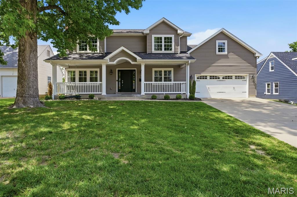 Welcome to this charming Kirkwood home, tucked away on a quiet cul-de-sac and offering the perfect blend of comfort, style, and functionality. A welcoming front porch and attractive curb appeal set the tone for the inviting spaces within.

Step inside to discover newly refinished hardwood floors, abundant natural light, and a thoughtfully designed floor plan ideal for both everyday living and entertaining. Formal living and dining rooms flank the entry, and are open to one another. A spacious family room provides a comfortable gathering space and features a convenient wet bar along with direct access to the backyard through sliding doors.

The beautifully appointed kitchen is sure to impress, featuring a large center island, walk-in pantry, stainless steel appliances, and ample cabinetry. Just beyond, the mudroom and main-floor laundry offer everyday convenience with easy access to the attached two-car garage. A stylish full bath on the main level also serves guests with ease.

Upstairs, the generous primary suite includes a walk-in closet and private retreat-like feel. Four additional bedrooms and a well-appointed hall bath provide plenty of space for family, guests, or a home office.  Both bathrooms feature heated floors for year-round comfort.

The finished lower level expands the living area, offering endless possibilities for recreation, fitness, work, or play. Outside, the fully fenced backyard provides plenty of room to relax, entertain, and enjoy the outdoors.

Thoughtfully updated and exceptionally well laid out, this Kirkwood gem is ready to welcome its next owner home.