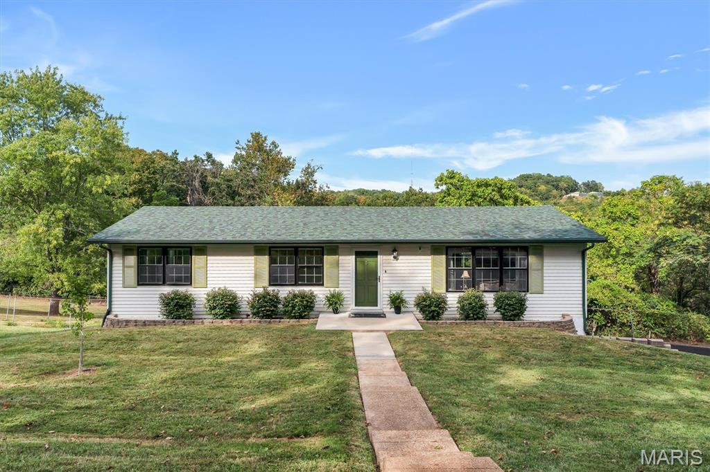 Welcome home to this inviting 4-bedroom, 2-bath ranch offering over 1,700 sq ft of comfortable living on a spacious .33-acre interior lot in Weber Hill Terrace. Step inside to a bright living room with luxury vinyl plank flooring, flowing into a dedicated dining room and a generous breakfast room with ceramic tile that connects seamlessly to the kitchen. The main level features three bedrooms—including a hardwood-floored primary with its own half bath—and an updated full bath with marble flooring.

The finished lower level expands your living space with a recreation room, workshop, laundry area, and a large fourth bedroom with an egress window. Walk-out access from the basement adds convenience, while the oversized attached garage and off-street parking enhance everyday functionality. With newer flooring throughout, central air, attic fan, and all appliances included, this well-maintained home offers move-in-ready comfort in the Northwest School District. A wonderful opportunity in a quiet, established neighborhood. Don't miss out on this one!