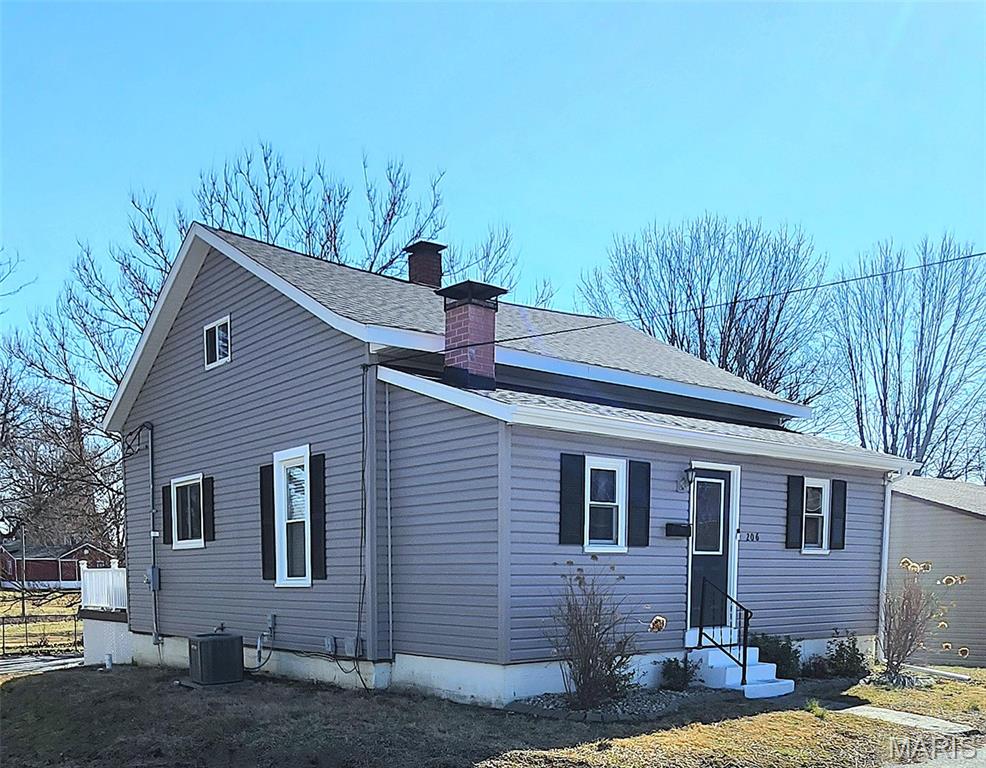 Significant price reduction on this handsome 3-bedroom home in the O'Fallon historic downtown district.  Enjoy confident, peace of mind living for years to come, knowing that the "Big Ticket Expense" items have all been replaced & updated over the past few years.  These items include - a NEW sewer line in 2026, NEW roof & siding in 2025, new HVAC system in mid 2022, upgraded 200-amp electrical panel inside, PLUS new outside service, modern LVP flooring installed in several rooms, fresh paint, vinyl double pane windows, and most recently the addition of a walk-in closet to the primary bedroom. The front of the house welcomes you with a large entry foyer, living room & stunning wood burning fireplace.  Loaded kitchen with double sink, white cabinets & all appliances included.  You will enjoy gathering for meals in the large separate formal dining room. The split-bedroom floor plan offers privacy, featuring the oversized primary bedroom up-front w/ the new walk-in closet, AND also a standard size closet.  Bedroom #2 is towards the back and is sizable as well.  Upstairs is a large, finished room with closet being used as Bedroom #3, and it also has space for an office or TV area.  A shaded composite deck with stairway overlooks the backyard and will provide years of maintenance free relaxation.  There is ample designated parking for multiple cars around back, and also a tuck-under garage with workshop area. The unfinished basement provides a laundry station, and more than generous space for storage. This home is much larger than meets the eye and is conveniently located less than a 5-minute walk from the historic downtown district of O'Fallon. This area features many popular restaurants, shops, and the park. Less than 15 minutes from Scott AFB & 20 minutes to downtown St Louis.