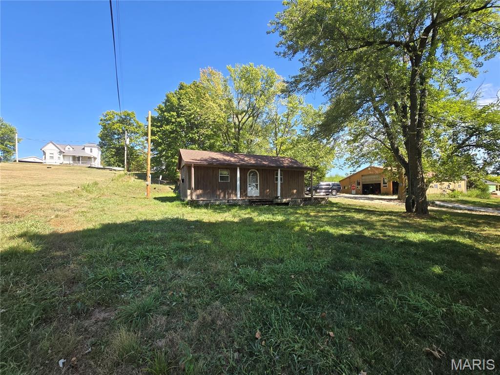 This 1600 square foot home is conveniently located in the Jackson School district with a large detached Shop/Garage that has a partially finished concrete floor - huge ceiling with setup for a working shop.  Step inside to find a wood burning fireplace in the living room that brings warmth and timeless beauty to the living space. The home  was built in 1974 and features 2 bedrooms and 2 bathrooms all on the main level, open floor plan for the living, kitchen, and dining area.  It features a large laundry and storage area. Centrally located in the Fruitland area close to restaurants and shops and other amenities.  This place is ready for your special touch to make it your own.