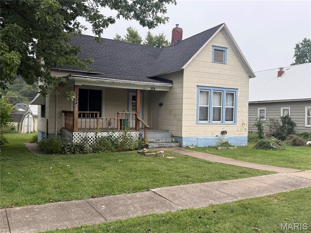 Welcome to 2519 Chestnut. The main level has large living room, dining room, kitchen, two bedrooms, and one bathroom. The washer/dryer connections are on the main level in one of the bedrooms. The bathroom has a walk-in shower. There is a front porch and back deck to enjoy the outdoors. Home has an unfinished basement. There is a three car detached garage with small engine lift and an additional storage trailer in the backyard. The garage is accessible through the backyard or the alley behind the house. The home has replacement windows.