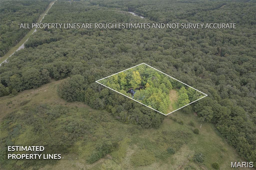 Build your dream home in the Farmington area now.  Located just 6 miles from Farmington on Hwy 32.  Make this choice your best with zero restrictions on 3.05 raw acres.  New survey to be uploaded soon with additional pictures.