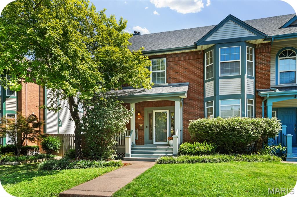Welcome home to this move-in ready Central West End townhome, delivering an impressive 3 bedrooms, 2.5 bathrooms, and over 2,500 square feet of total living space! The main floor features a welcoming foyer, a separate dining room with a bright bay window, and a spacious living room centered around a cozy wood-burning fireplace. The flow continues into a bright eat-in kitchen, a convenient main-floor laundry room, and an attached two-car garage with plenty of room for large vehicles. Upstairs, brand new carpeting spans the entire level. The expansive primary suite easily fits a California King bed and boasts a walk-in closet and a spa-like en-suite bath with dual vanities, a walk-in shower, and a soaking tub. Two additional large bedrooms, including one with a charming bay window, share a full hall bath. The finished basement adds over 800 square feet of flexible space, perfect for a media room, home gym, or office, plus a separate bonus room and ample storage. Outside, the back deck is built for weekend grilling, overlooking a large, flat, fully fenced yard ideal for pets and play. Located on a peaceful street with a traffic-calming roundabout, commuting is effortless with quick access to Highway 64 and Interstate 44. Best of all, you are just a short stroll from Forest Park, Barnes-Jewish Hospital, SLU, Cortex, City Foundry STL, and the neighborhood's best dining and shopping!