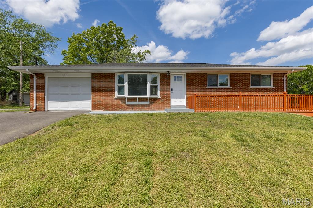 NEW LISTING ALERT!!! This beautifully updated all-brick ranch style home offers 4 spacious bedrooms with 2 full baths and over 1700+- sq ft of living space. This move-in ready property features all the bells and whistles throughout. Home shows beautifully and has been rehabbed from top to bottom. The perfect starter home, or perhaps your looking to downsize, this beauty is sure to check off all the boxes of your needs and wants. Step inside to your open and inviting great room with stunning bay window, and immediately feel right at home. Large eat in kitchen features bright modern 42' inch white custom cabinetry providing ample storage space, granite counter tops with custom backsplash and a set of stainless steel appliances to remain for your culinary pleasures. Luxury laminate flooring and canned lighting flows throughout the main living areas, complemented by updated doors and trim for a fresh cohesive and modern feel. Ceiling fans are included in all bedrooms with remotes. An abundance of windows fill the home with natural light, creating a warm and inviting atmosphere with spectacular views any time of the year. The finished lower level expands your living space with the additional fourth bedroom with walk in closet, egress window, full bath, washer and dryer connections, with walk-out. Perfect space and access for guests, a home office, or additional entertaining space. Step outside to enjoy the brand new wraparound deck overlooking your level fenced in backyard, ideal for relaxing or hosting small or large gatherings or even the ideal space for the family pet. Enjoy the benefits of peaceful rural-style living with newer septic system and propane, while still being just minutes from Gravois Bluff, shopping, dining and everyday conveniences. Enjoy peace of mind with new systems, updated plumbing, electrical, and energy-efficient windows with newer roof. Single car garage comes complete with garage door opener and additional outside parking. Located in the desirable Northwest School District this home offers the perfect balance of comfort, updates, and location. Don't miss out on this GEM of a find! Impeccable attention to detail has been showcased in every update. Call for your personalized tour before it's to late.