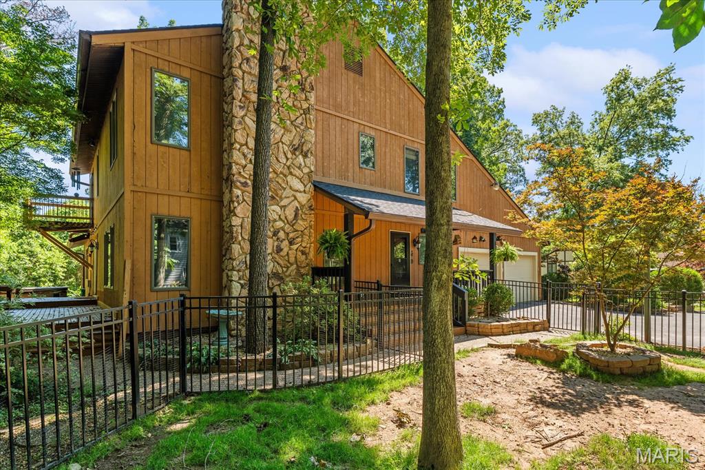 Custom architect-designed cedar home on a quiet cul-de-sac, with 3 bed and 3.5 bath. This 4,892 sq ft home blends timeless design, natural materials, and modern upgrades in a private, wooded setting.

Built with energy-efficient 2x6 construction, enhanced insulation, and an emphasis on natural light, the home offers a warm, sun-filled main level with brand-new bamboo flooring, solid-core interior doors, and a bright kitchen, looking out to the main living space, with new dishwasher and updated cooktop. A cozy gas fireplace anchors the main living space.

The upper-level primary suite is a true retreat featuring dual walk-in closets and a brand-new private deck overlooking mature trees. All four bathrooms include granite countertops and ceramic flooring.

The newly finished lower level is designed for entertaining with a spacious recreation area and custom bar with integrated wine and beer coolers. Additional finish space include a 400 sq ft attic area. Plus there is an approximately 300 sq ft workshop, offering excellent flexibility for storage, hobbies, or future use.

Outdoor living includes a 6-person spa with new pump and heater, multiple refreshed decks and porches, and a secure metal-fenced yard backing to woods. The property features established blackberry and blueberry bushes along with cherry and peach trees, with deer and fox sightings enhancing the natural setting.

Recent updates include: 2026—new roof, primary suite deck, spa pump/heater, solid-core interior doors, cedar porch swing, exterior doors/storm doors, and full exterior deck/porch painting. 2025—water line replacement, French doors to deck, metal fencing. 2024—complete lower-level finish with custom bar, new dishwasher, and bamboo flooring throughout upper level, stairs, family room, and dining room. 2023—new cooktop.

*Ask for an list of recent home improvements!

Originally designed by architect Noel Weisenstein (WHGK) and later owned by a retired architect, the home reflects intentional design, energy efficiency, and long-term livability. Dont miss the chance to make this house your home!
